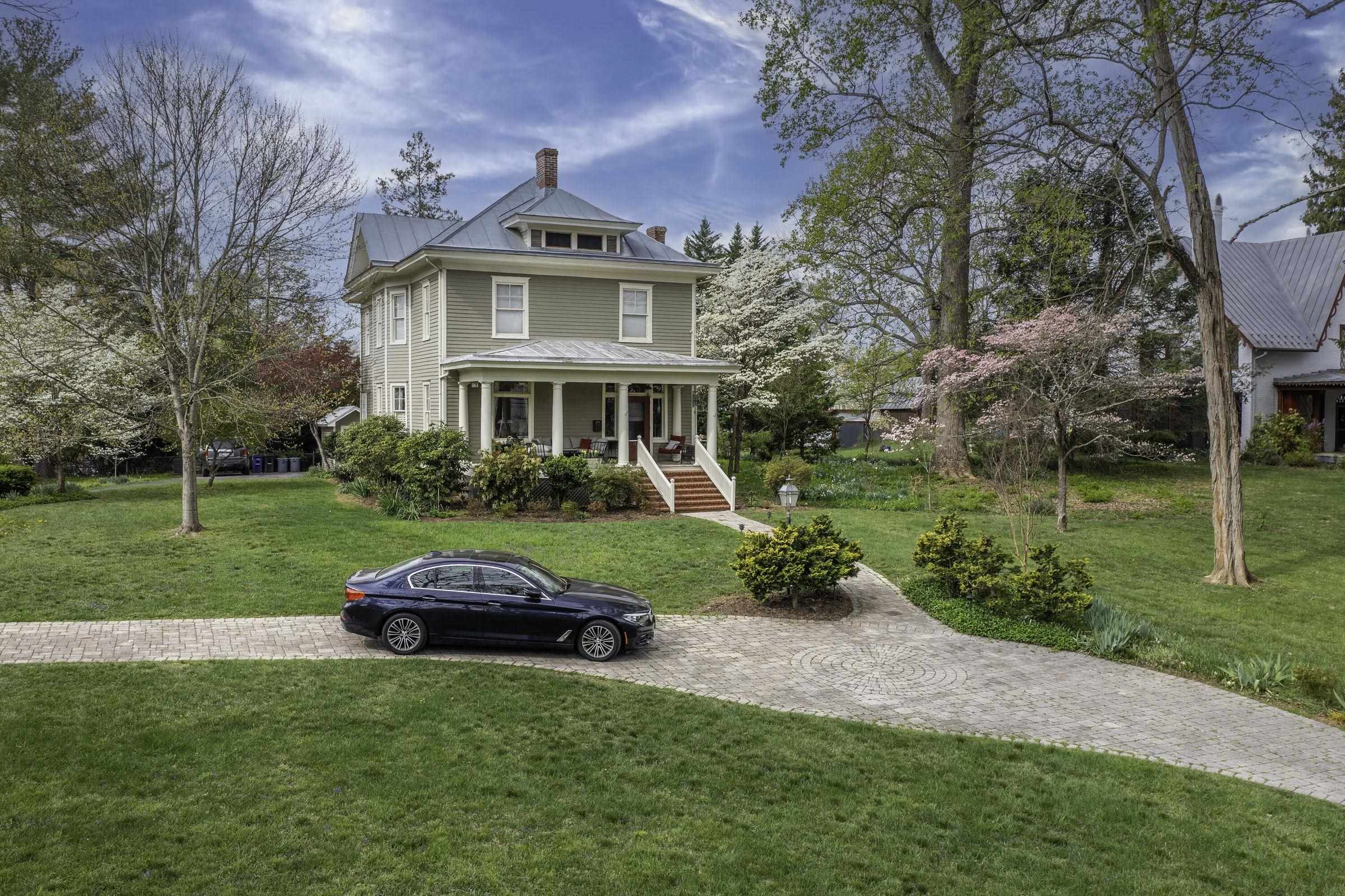 Circular driveway offers easy access to your home. The front lawn fills with purple violets each and every Spring.
