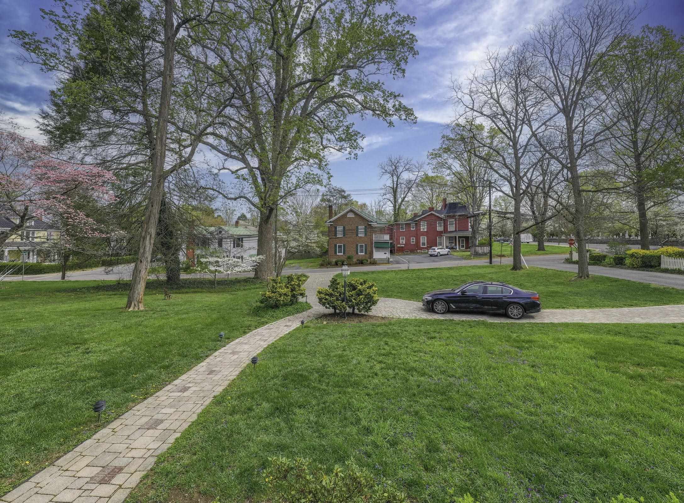 Classic beauty. From the porch, gaze on the expansive lawns and watch the Lexington Horse & Buggy Tours drive by.