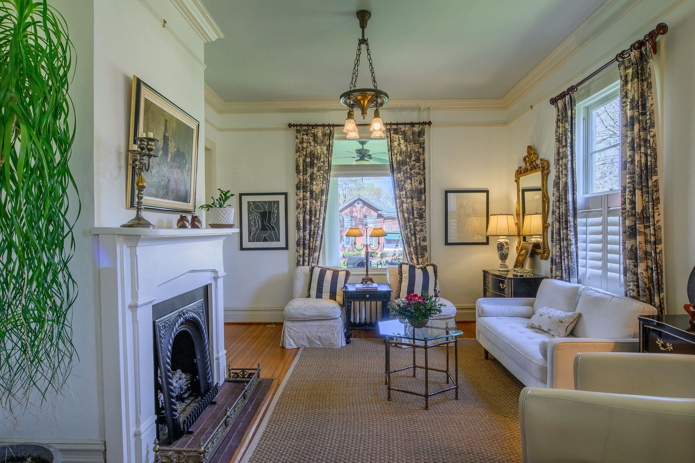 Classic Lexington living room features crown molding, deep floor molding, picture molding and a gas log fireplace.