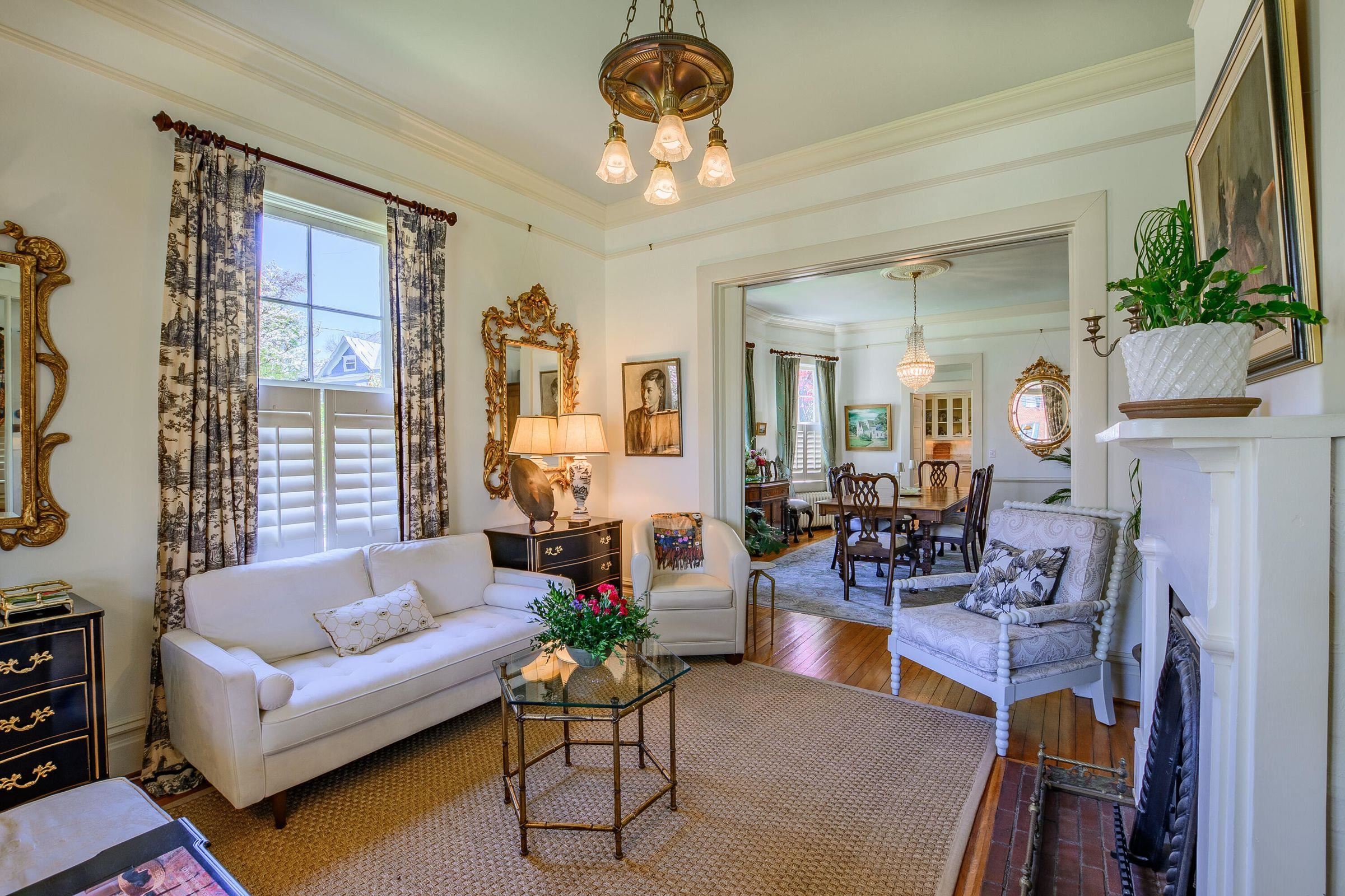 The parlor opens to the formal dining room.