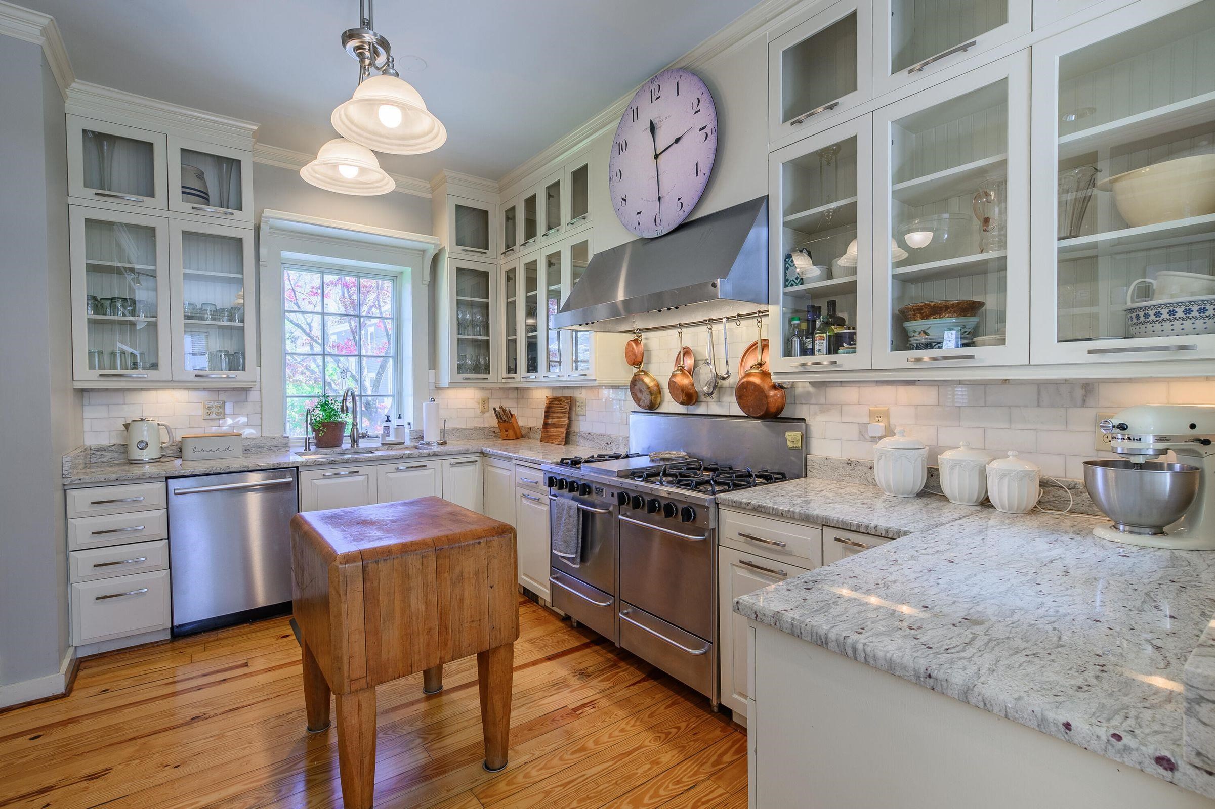 Double ovens. Upscale dishwasher. Sub-zero refrigerator. Glass-fronted cabinets.
