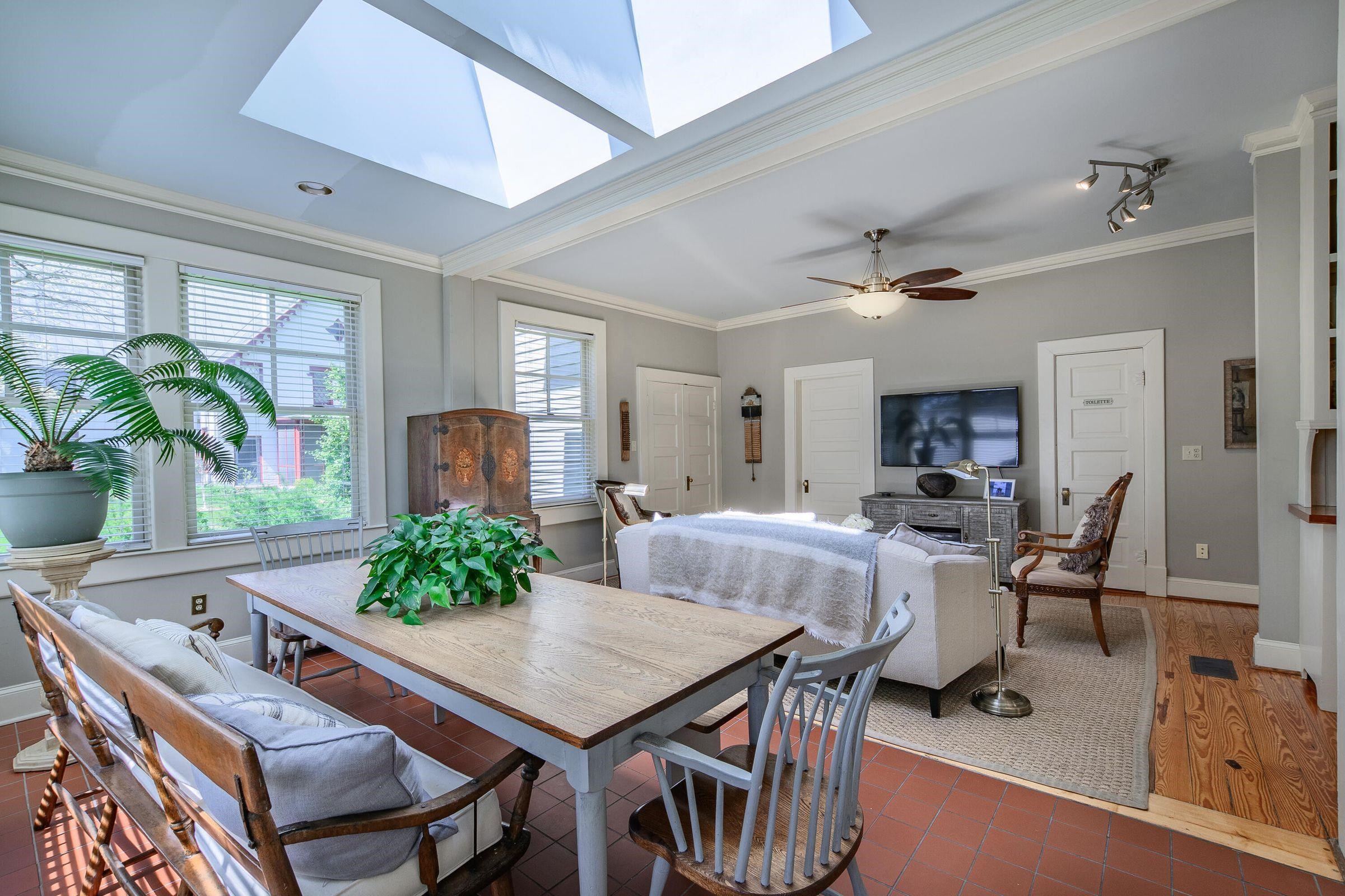 Family room is a new addition to the home. Great for TV and socializing around the French farm table.