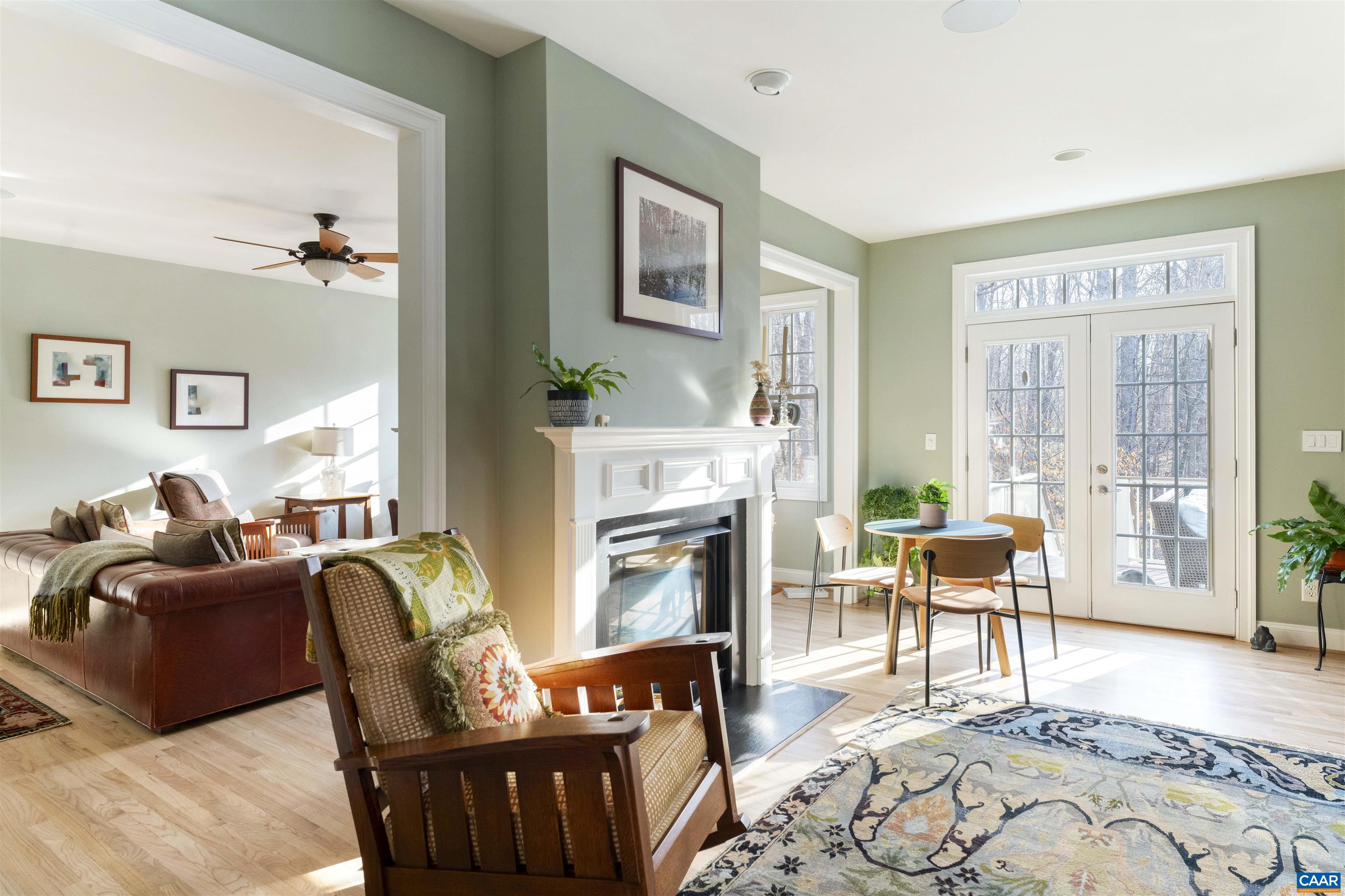 Fireplace divides the eat in area of the kitchen with the family room.
