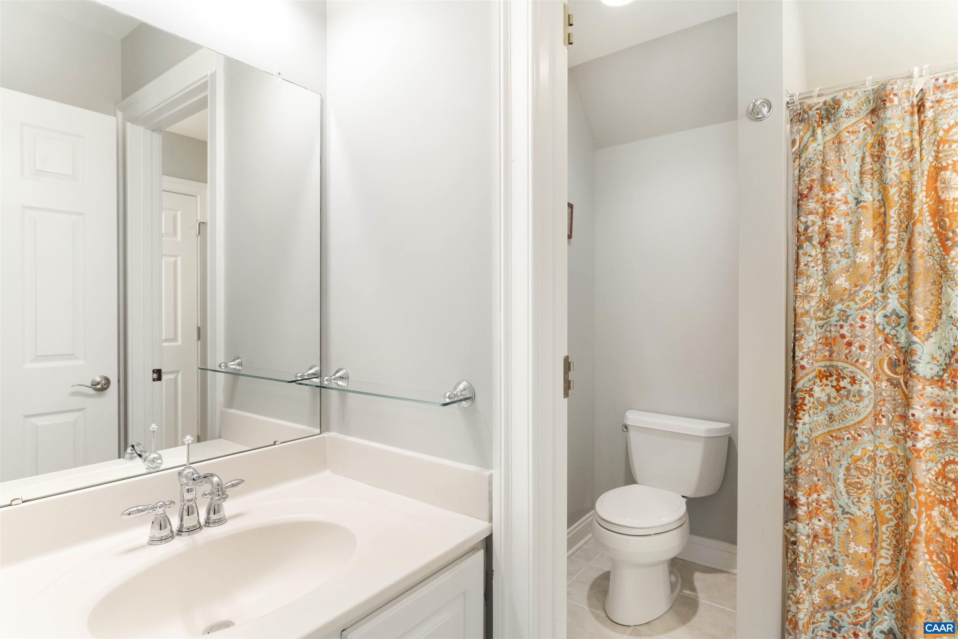 Opens to hallway on one side and a secondary bedroom on the other side.