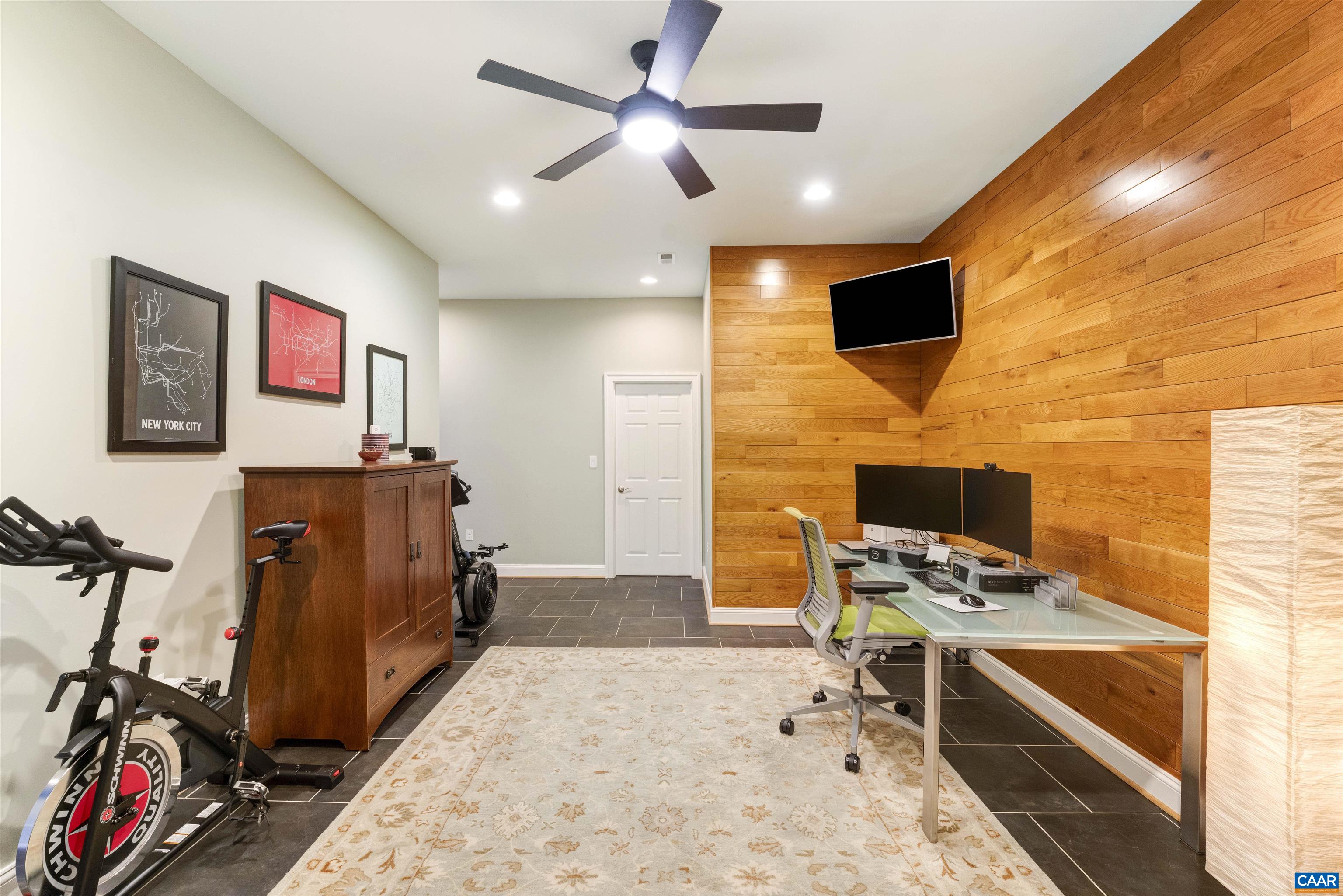 Flexible use space with beautiful wood detail on wall.