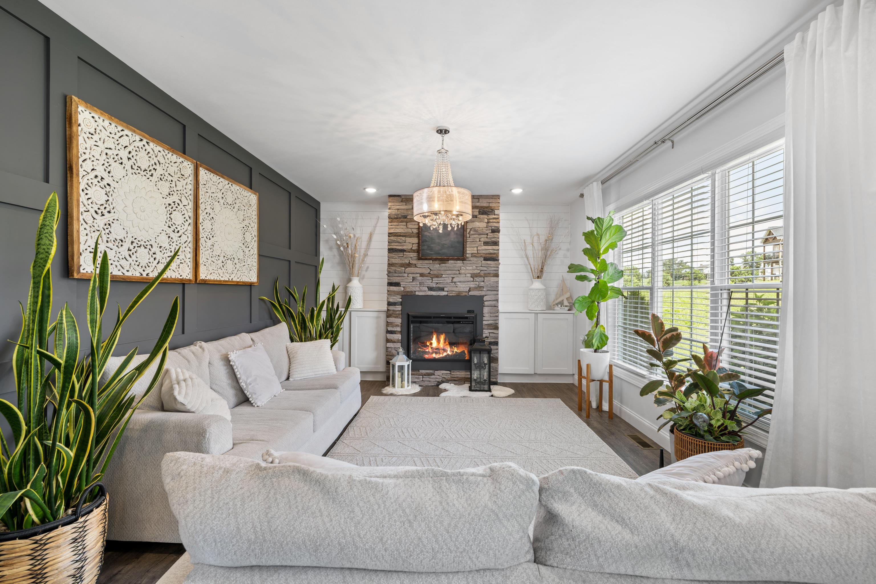 *electric fireplace improved by stone surround and built-in cabinets