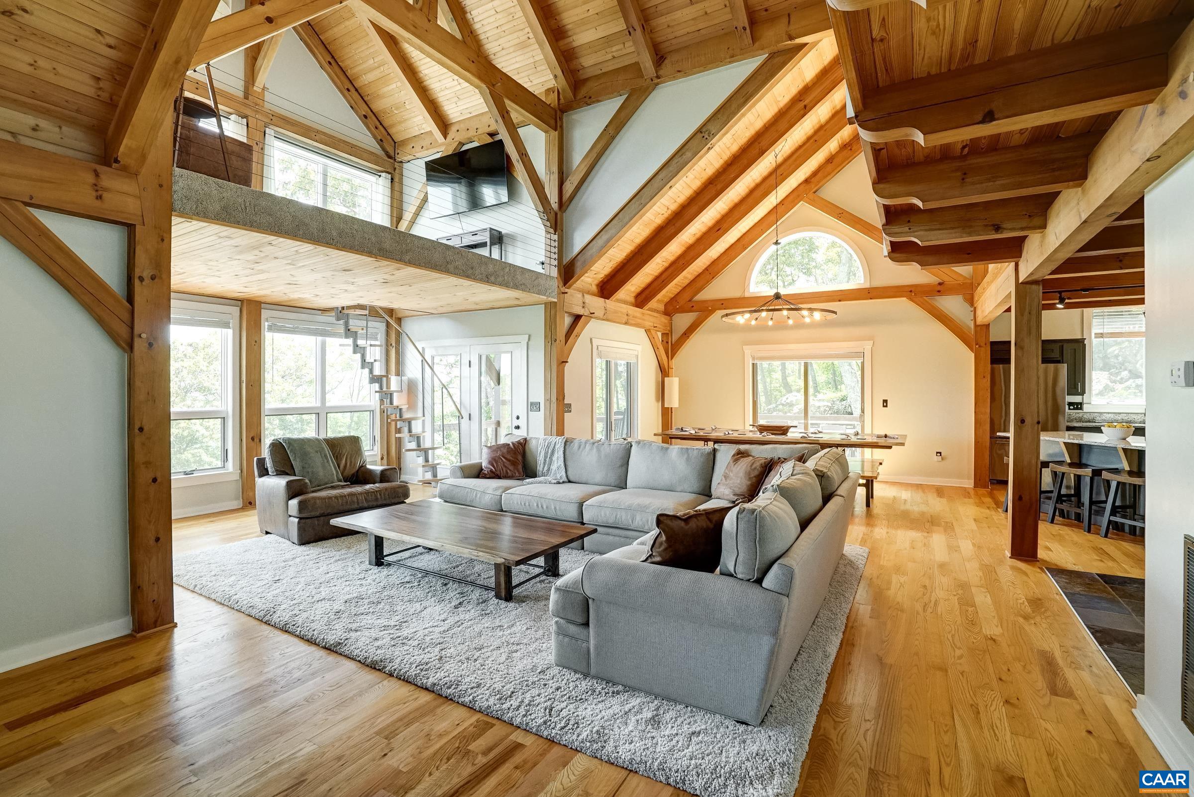 Natural hardwood floors, exposed beams and natural light abound!