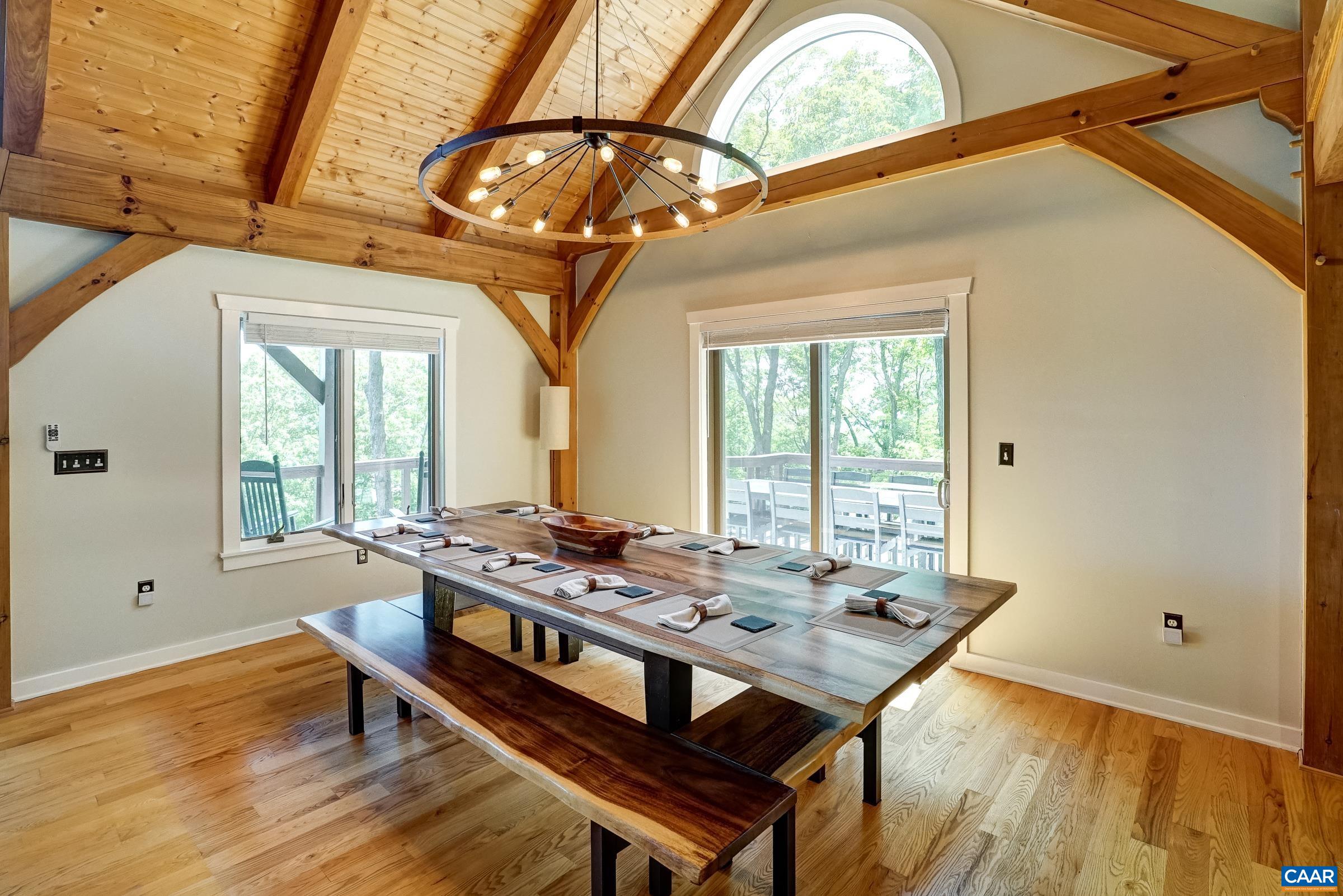 Grand dining room with stunning light fixture.