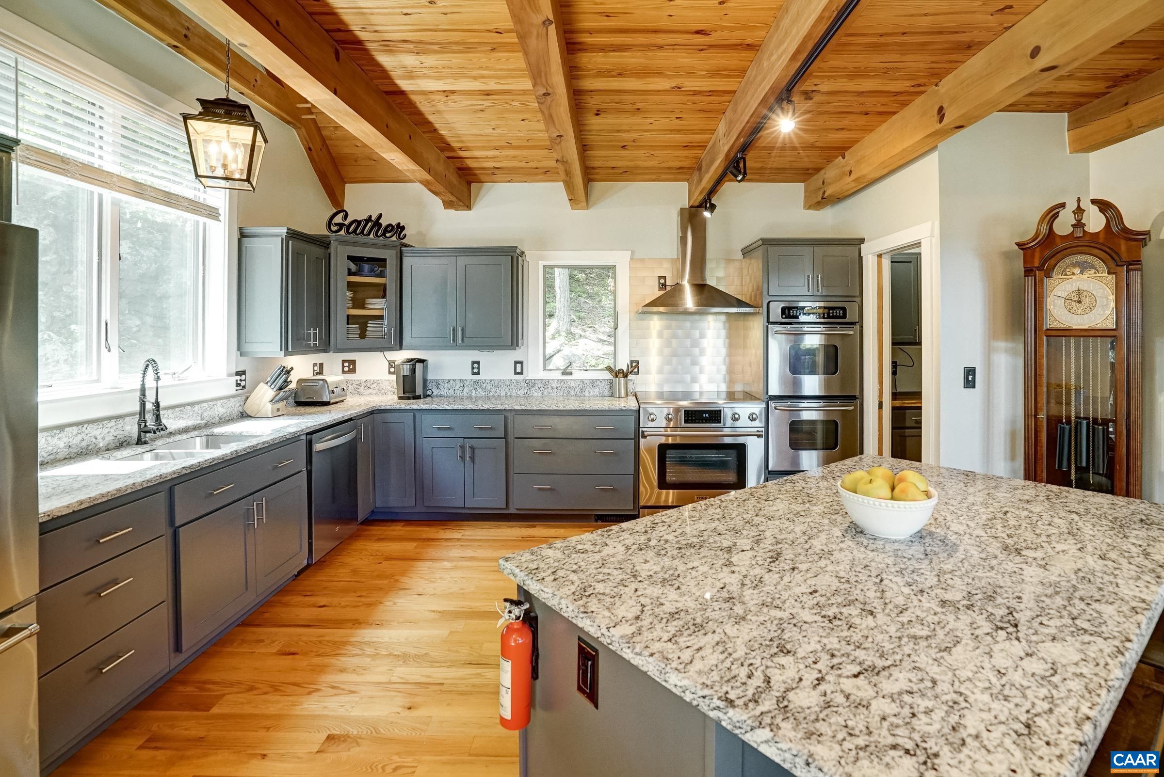 Large island with wine cooler.