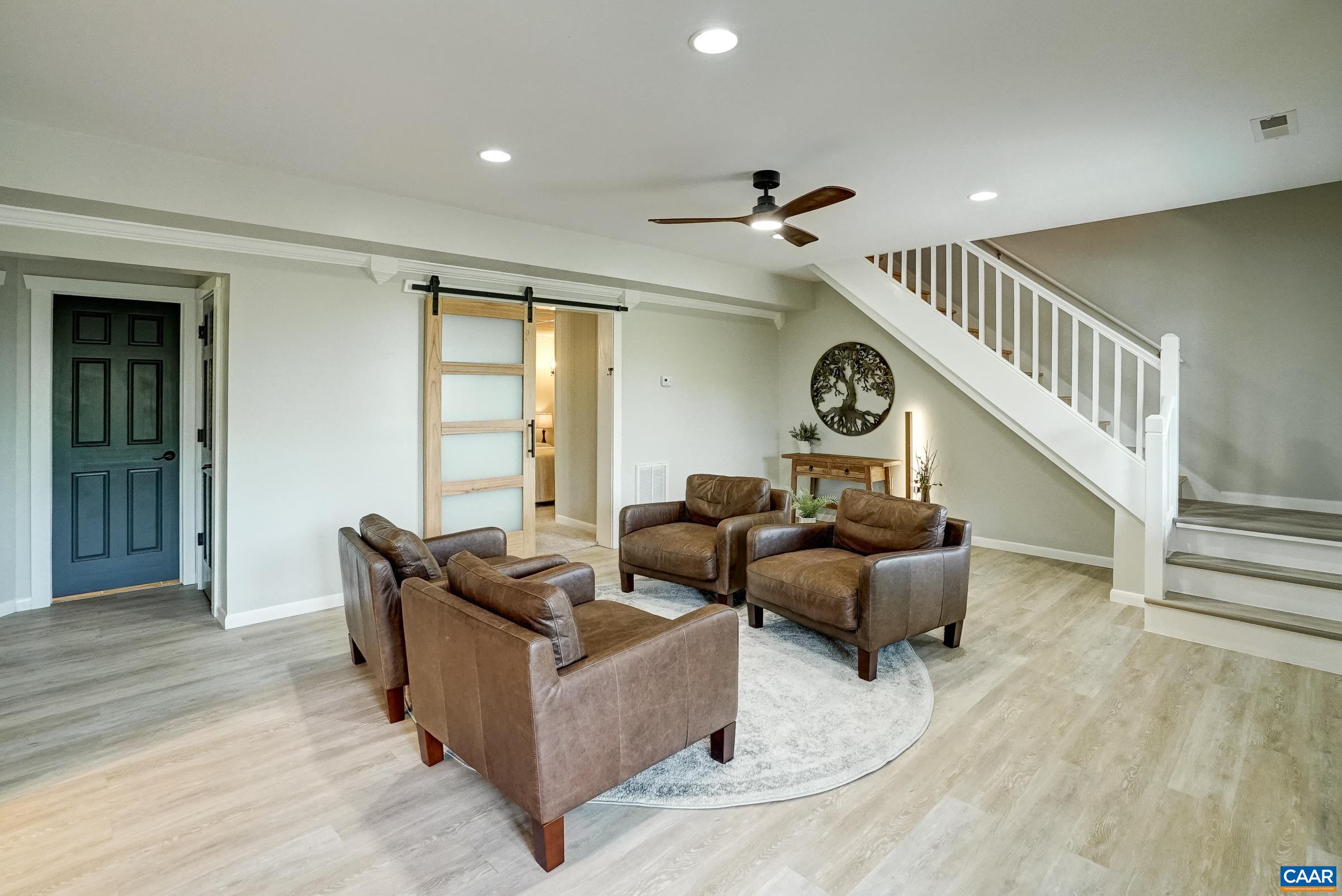 Lower level features luxury vinyl flooring and large rec room.