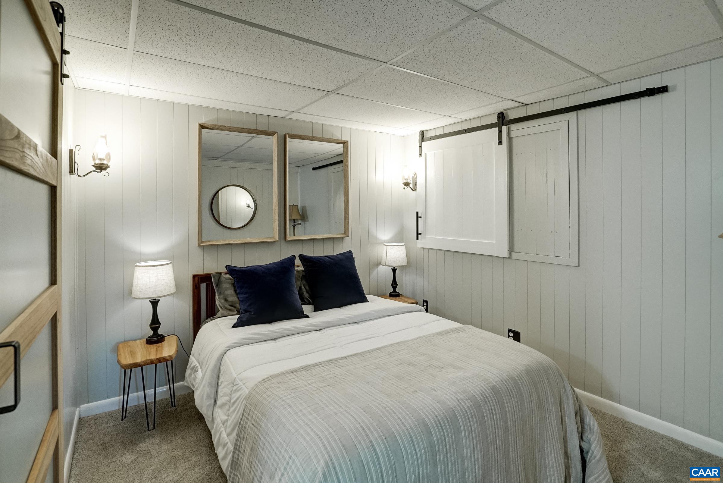Den/Home office on lower level with private bathroom.