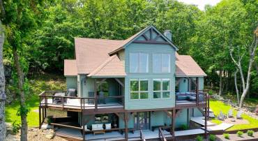 Spectacular post and beam retreat nestled on the mountainside at Wintergreen Resort.