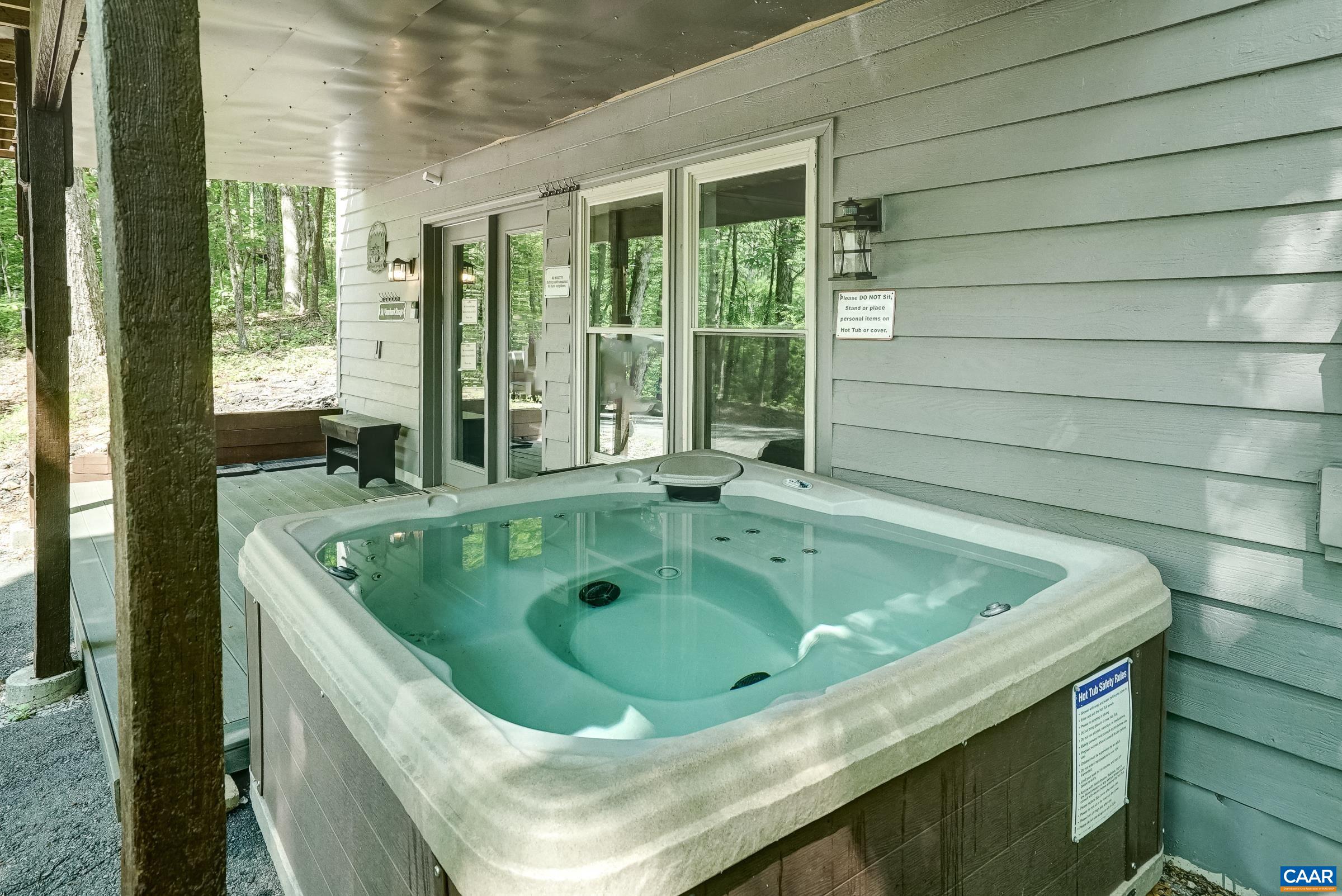 Soak your cares away in the hot tub on the covered patio.