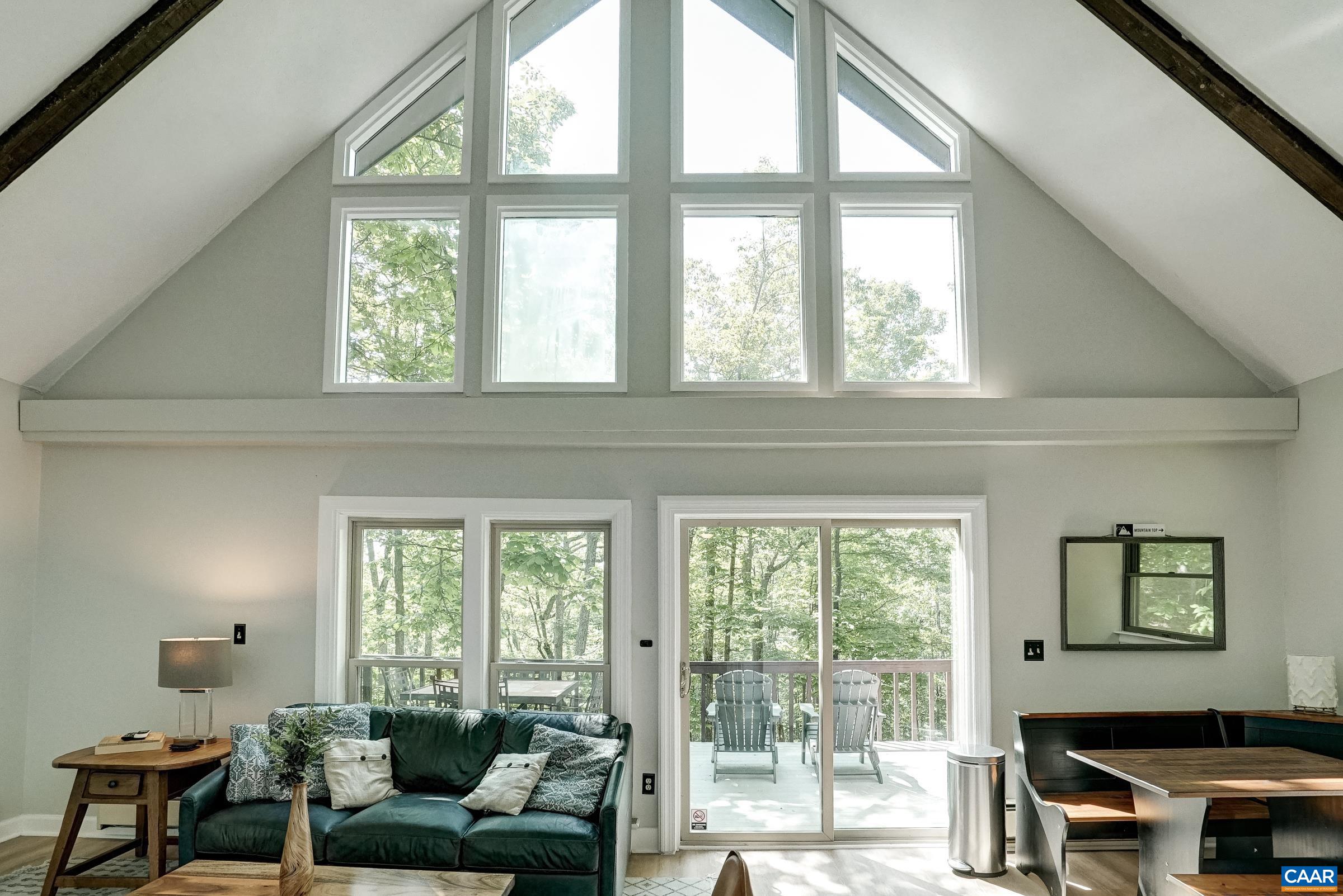 Vaulted great room with exposed beams!