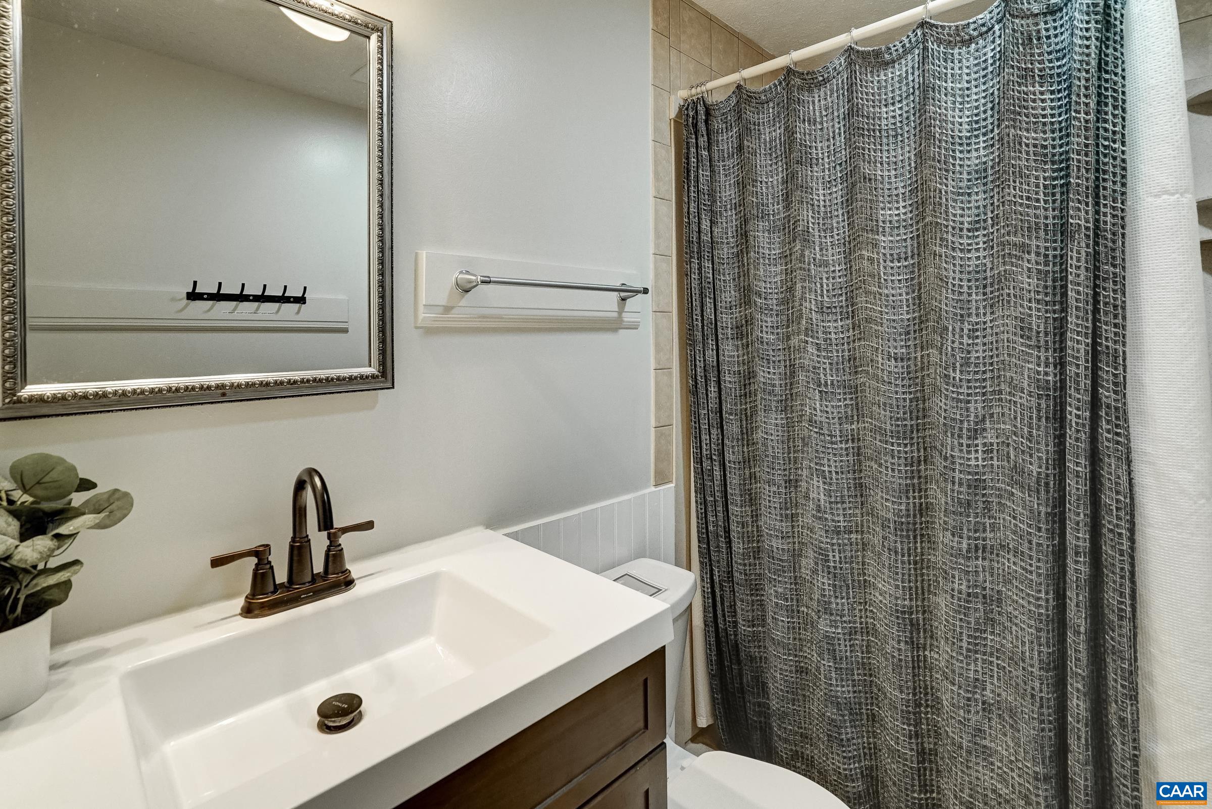Main level full bathroom - all bathrooms renovated in 2024.