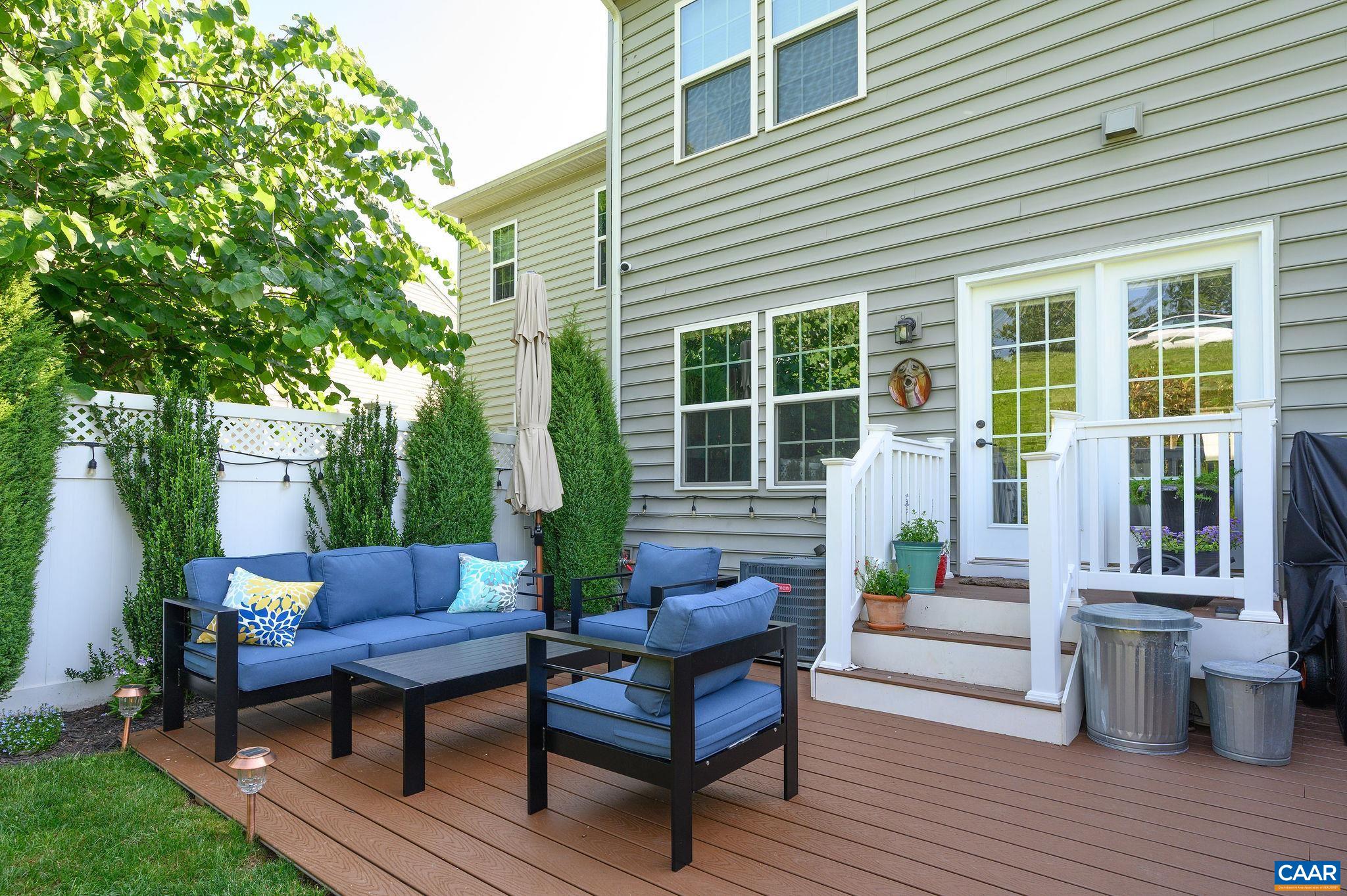 Wonderful private oasis off the kitchen that features a new trex deck, fencing, and landscaping.