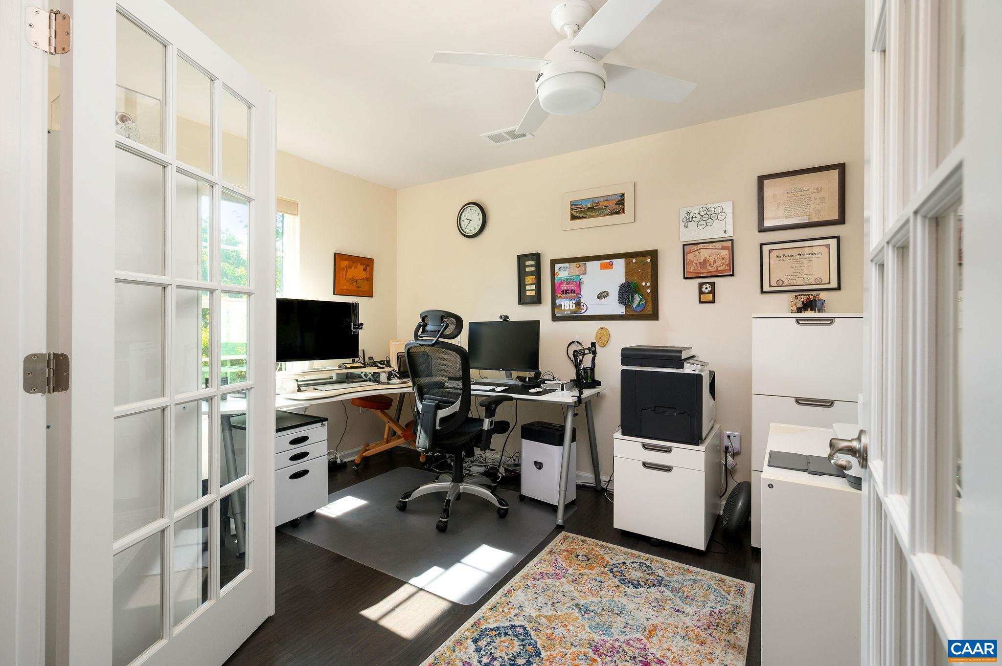 Spacious home office with loads of natural light.