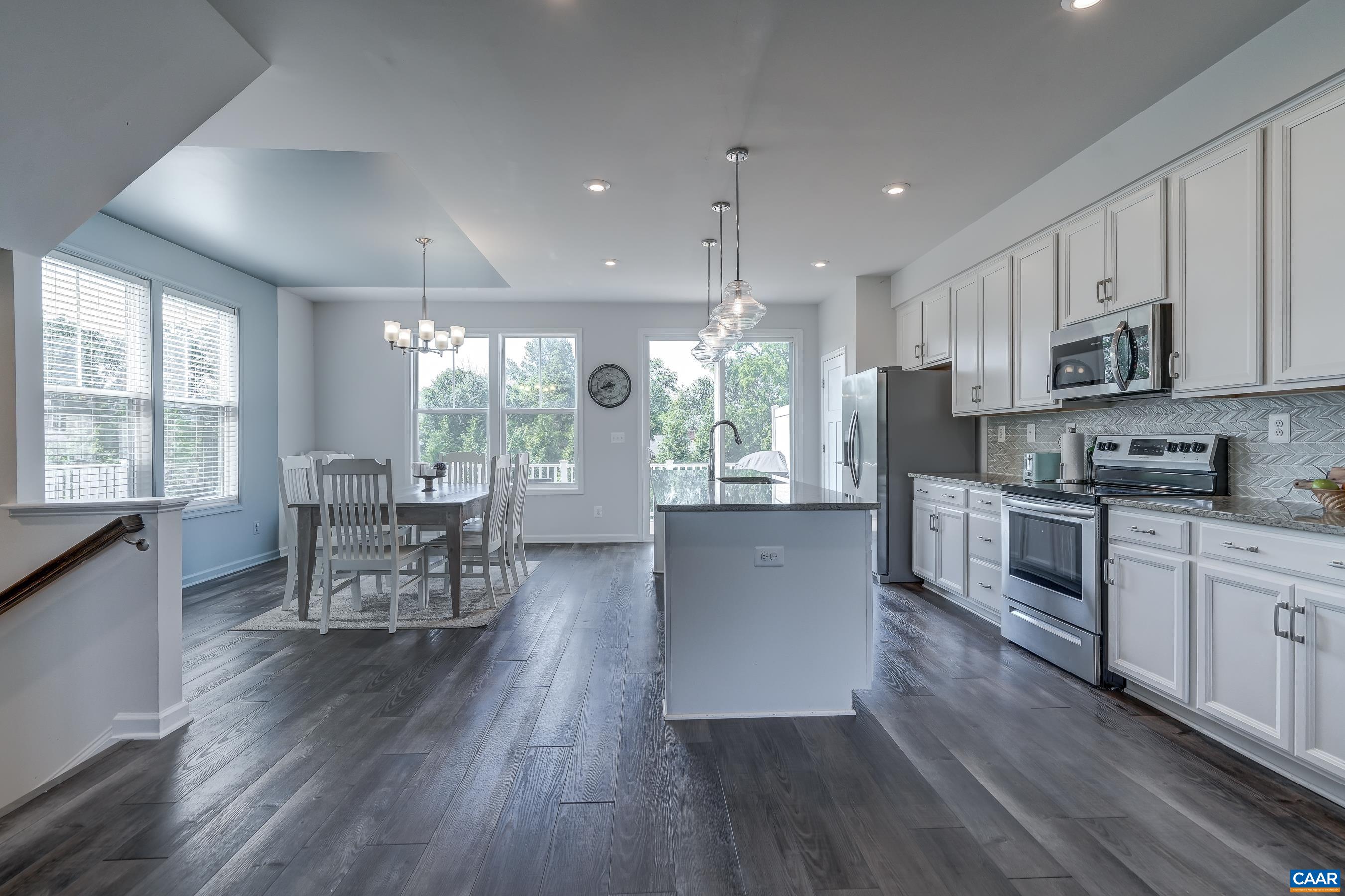 End unit allows for extra natural light in the dining room.