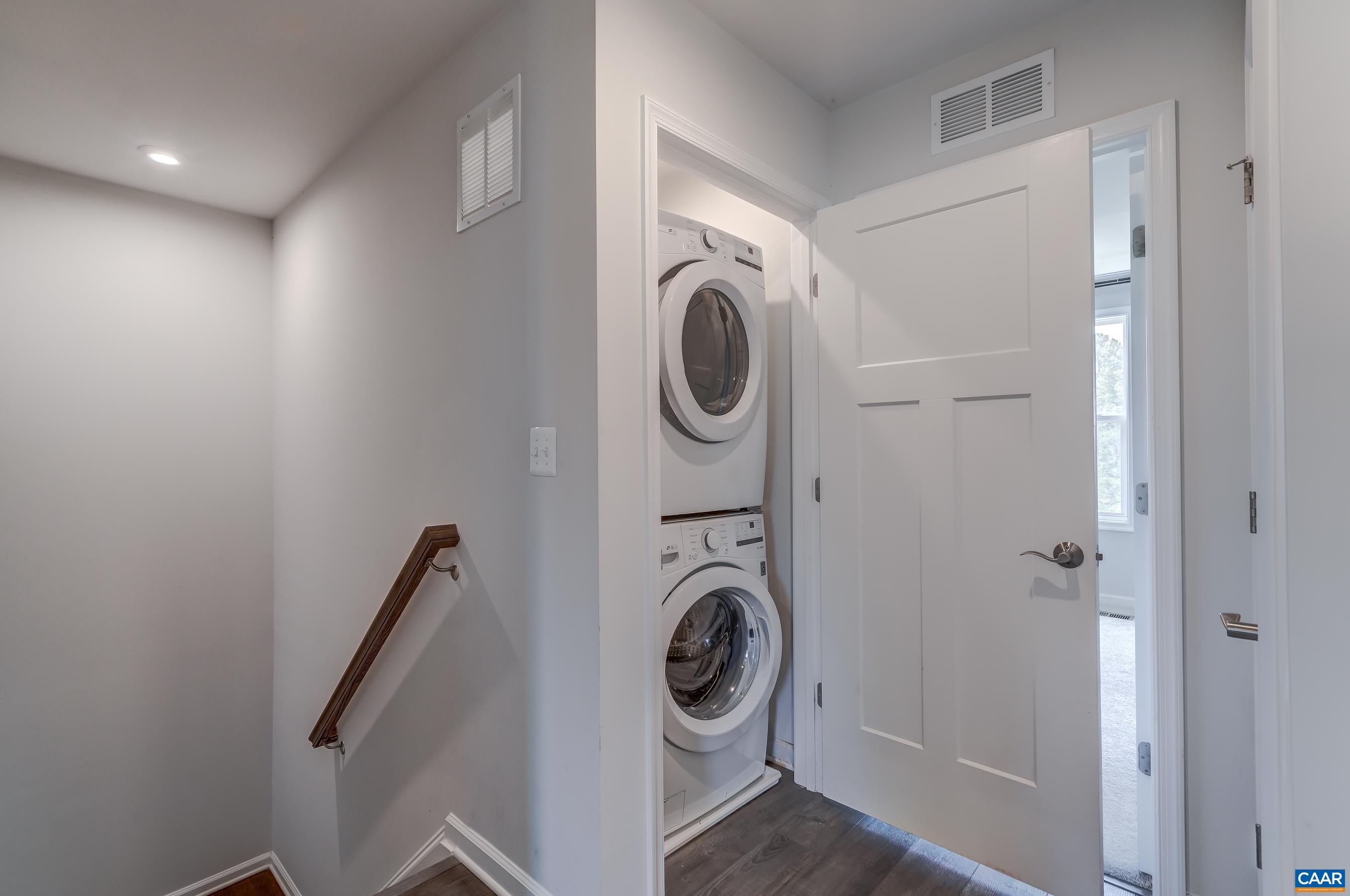 Full sized stacked washer and dryer.