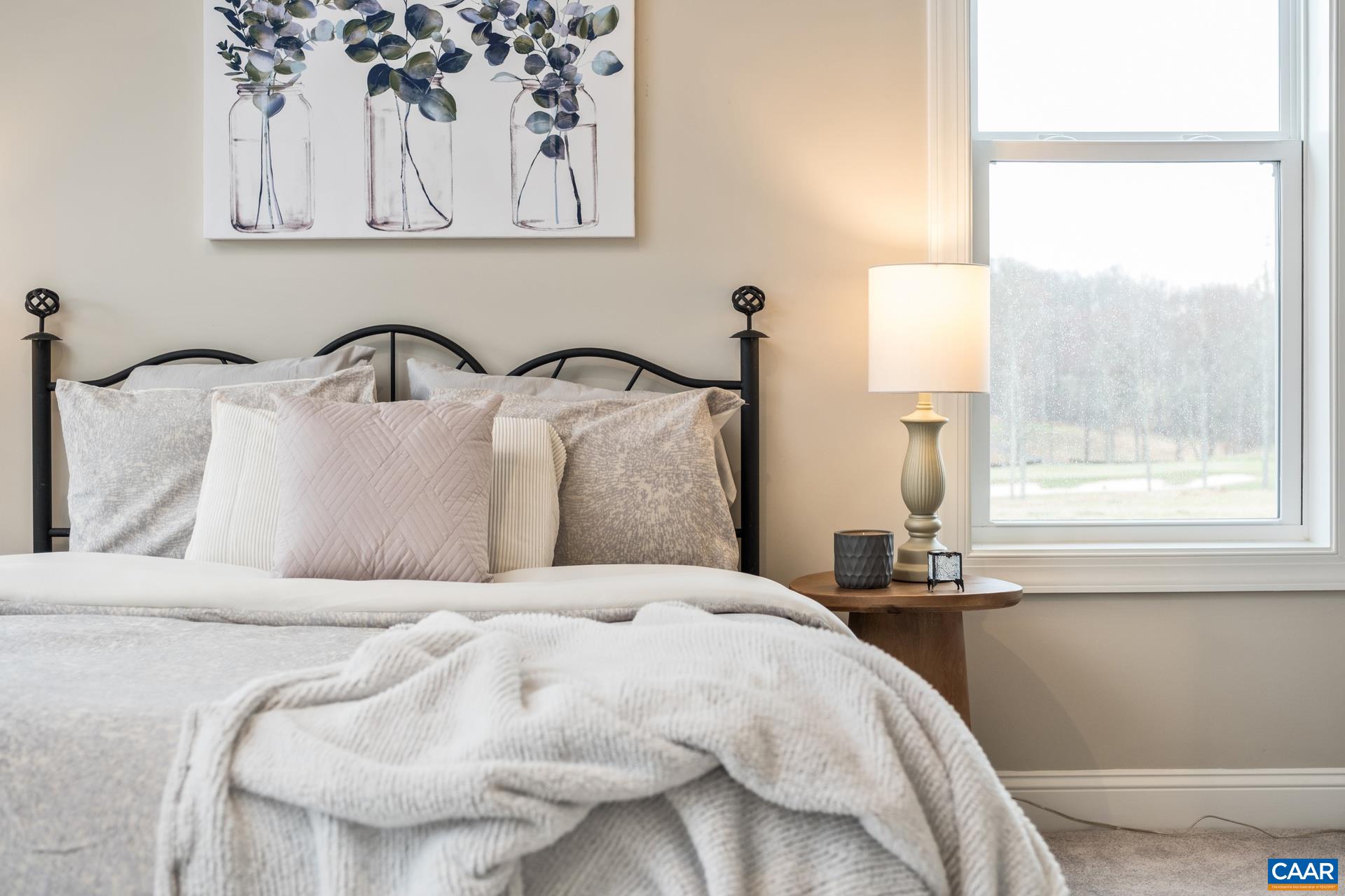 Relax in elegance and comfort in this spacious primary suite.