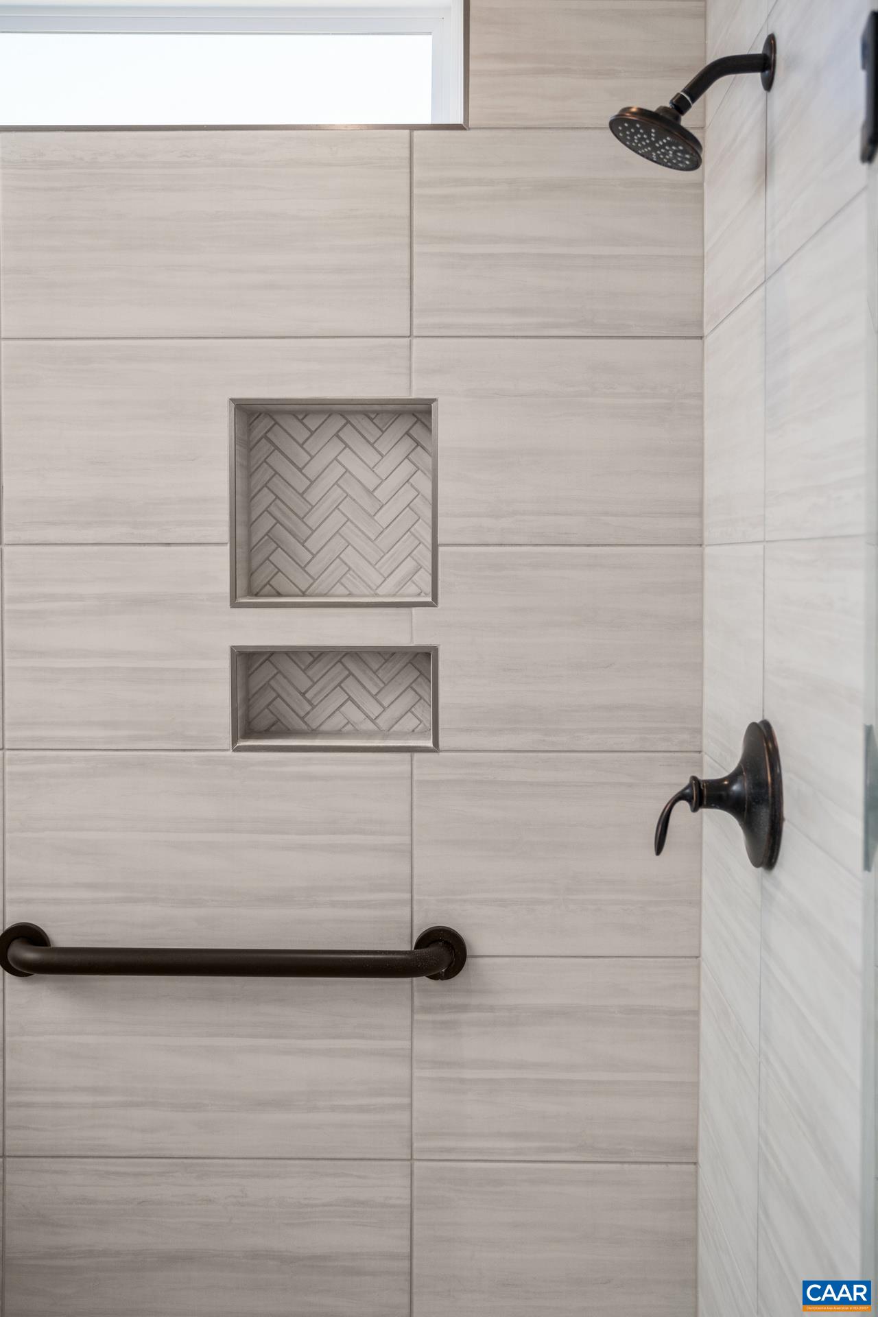 Shower also features an added grab bar for safety.