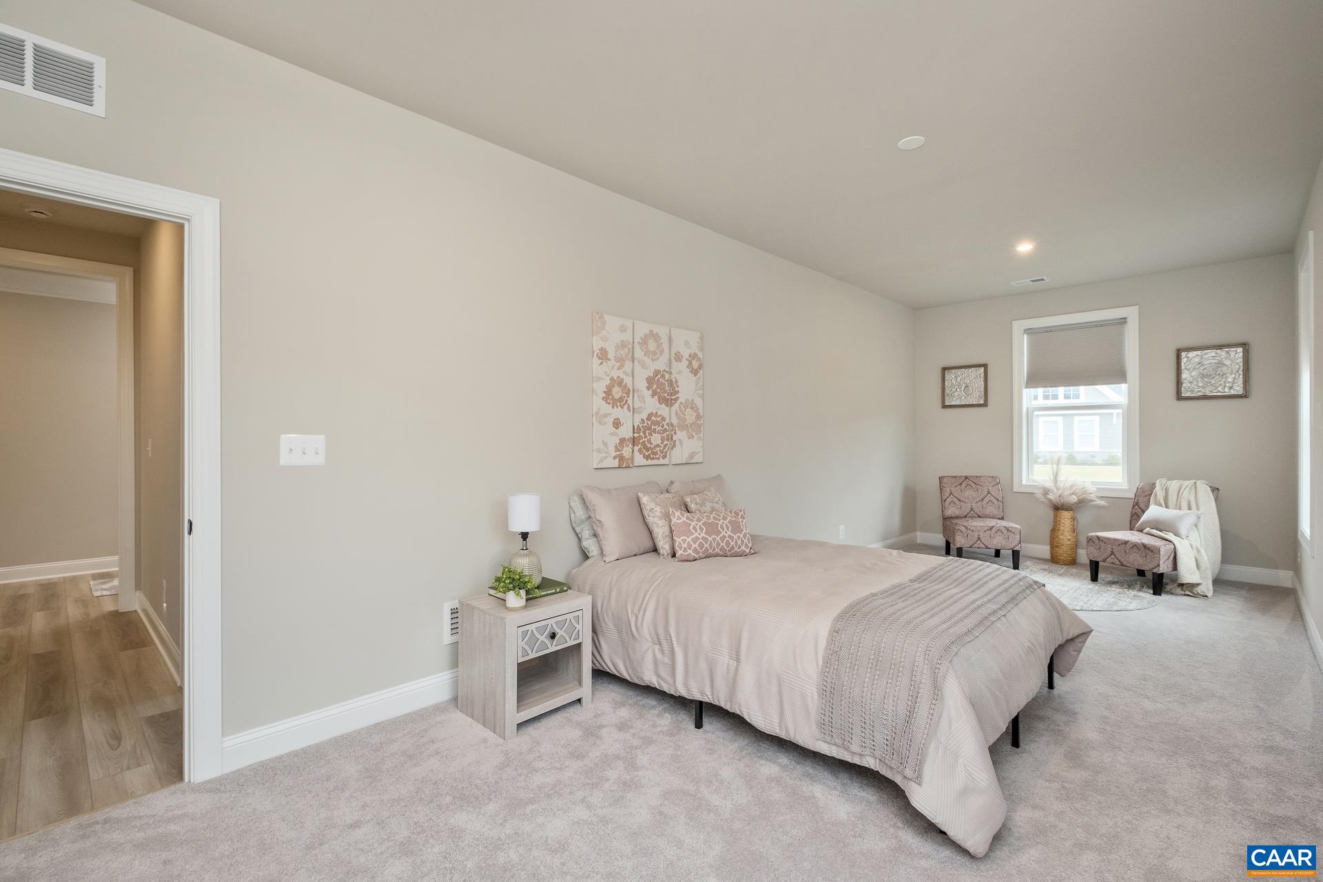 Bedroom 2 features a sitting area and a large, deep closet.