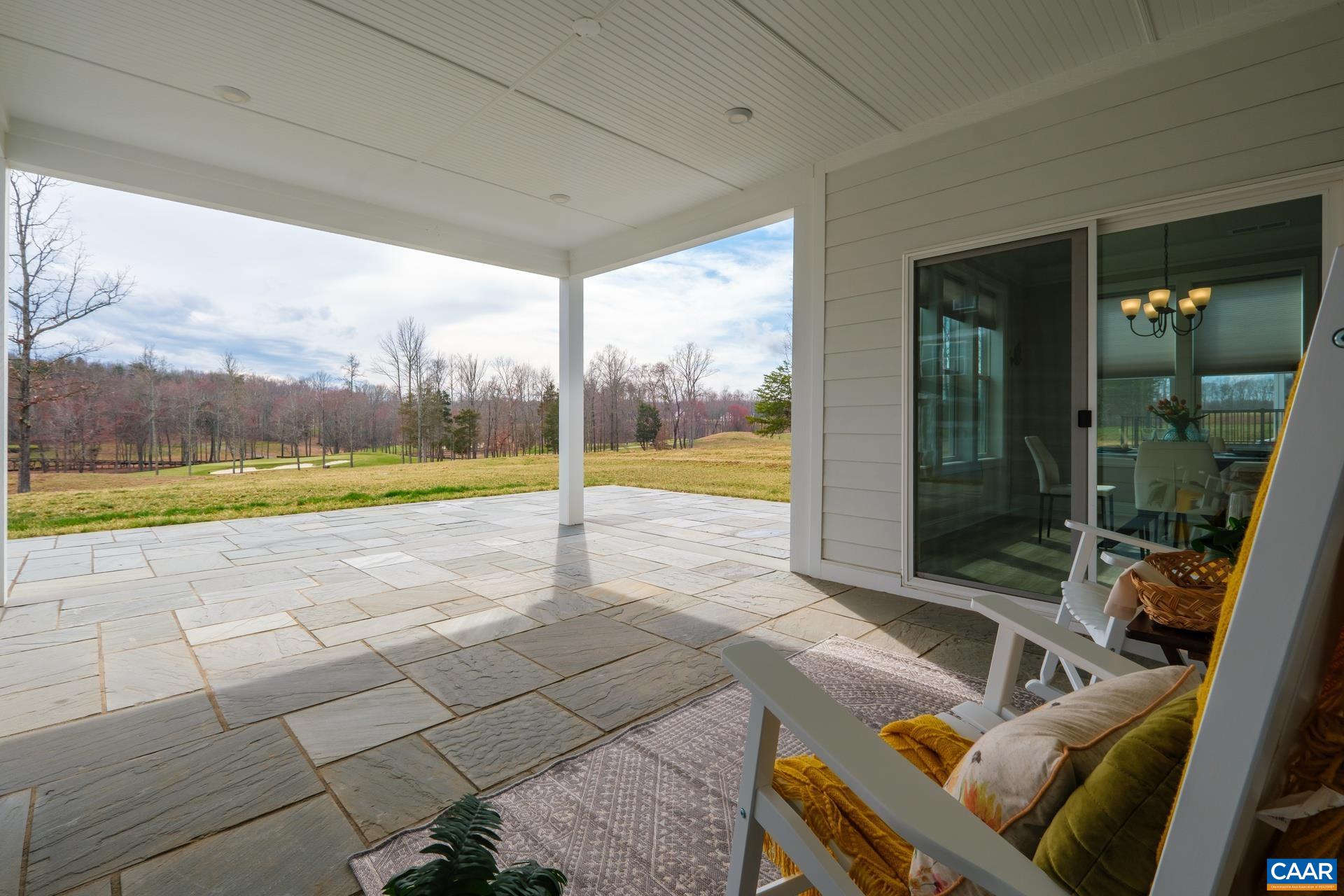 Another showcase feature! The custom built large thermal bluestone patio was added by the owners. Great care was taken with grading to make it flush with the yard. Owners extended the patio roof, and added a 120V outlet on a dedicated circuit + gas line.