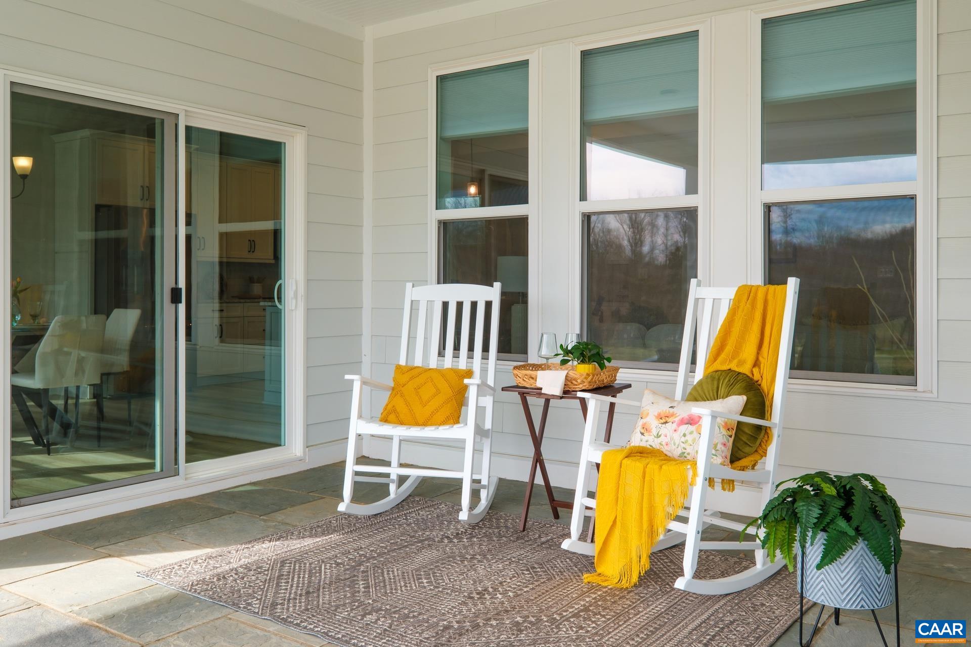 Another showcase feature! The custom built large thermal bluestone patio was added by the owners. Owners extended the patio roof, added a 120V outlet on a dedicated circuit, and added a gas line so it is ready for you to bring your outdoor kitchen!