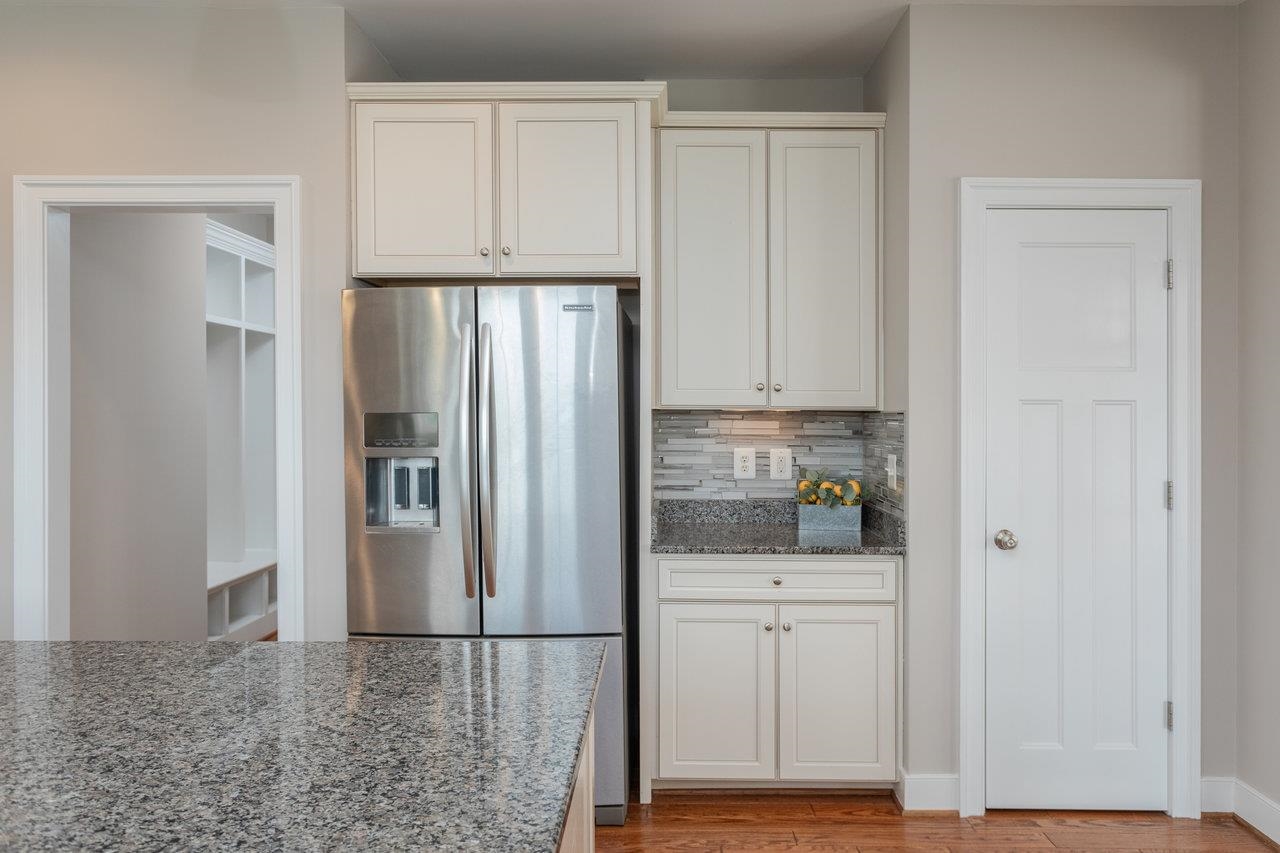 The door on the right is a pantry. The hall on the left goes to Formal Dining Room