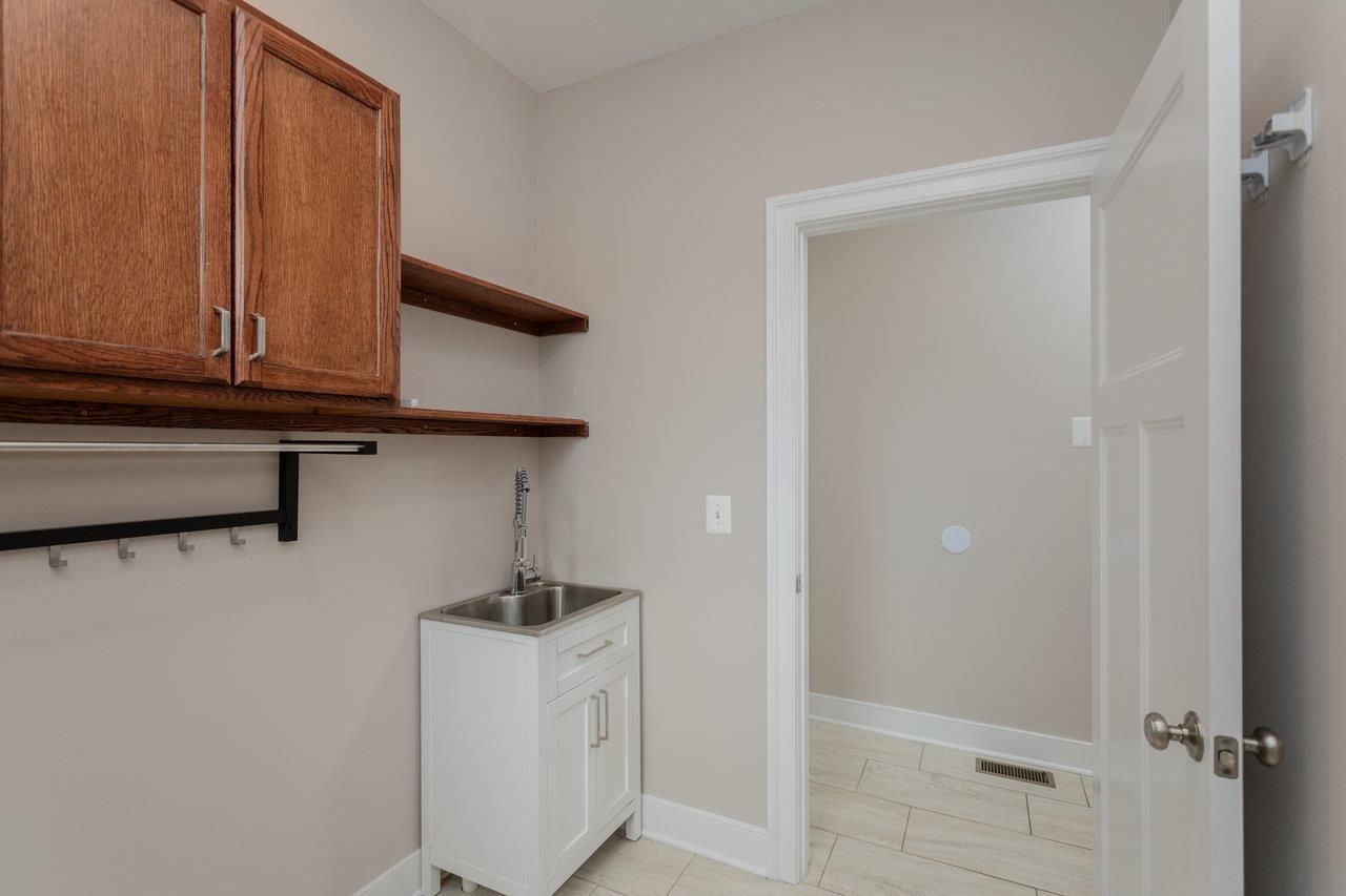 Complete with sink, cabinets and shelving