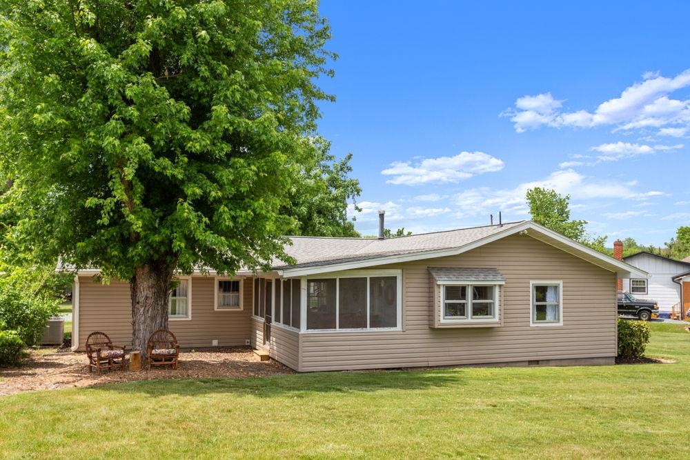 with screened porch off the renovated kitchen. Kitchen has a bumped out garden window.