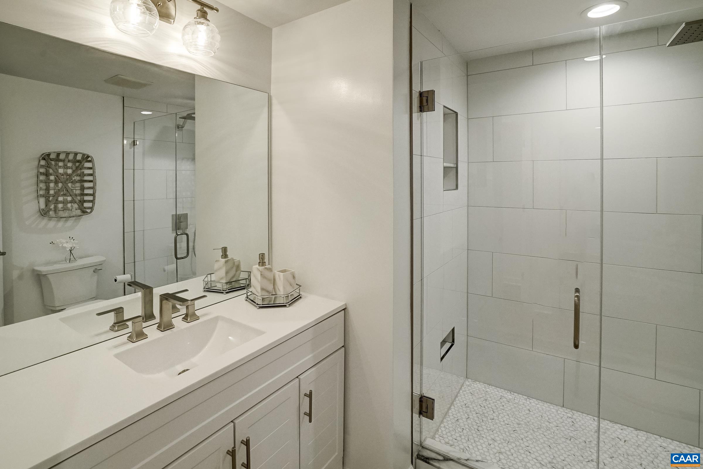 New full bathroom with frameless glass shower.