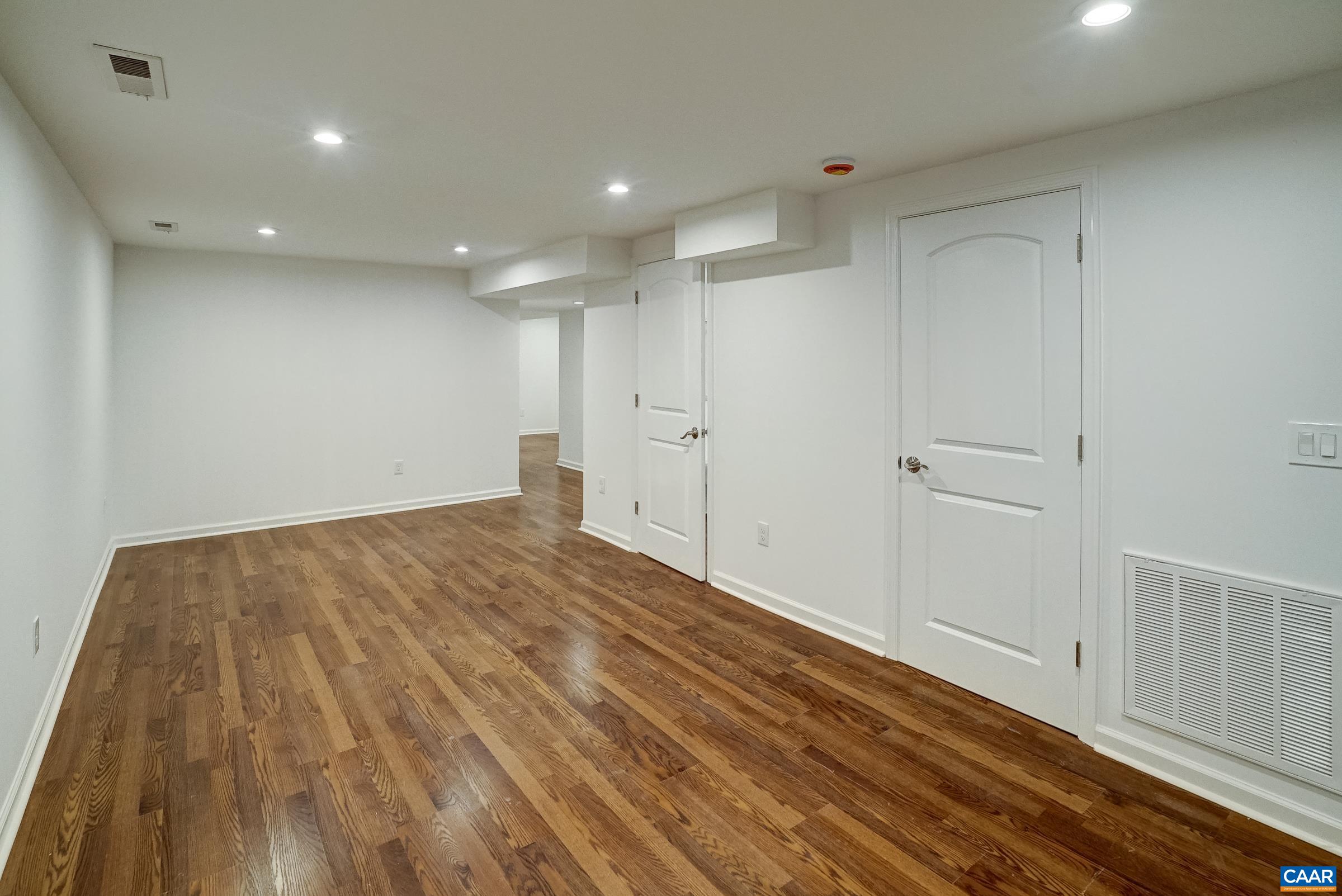 Basement features luxury vinyl plank flooring.