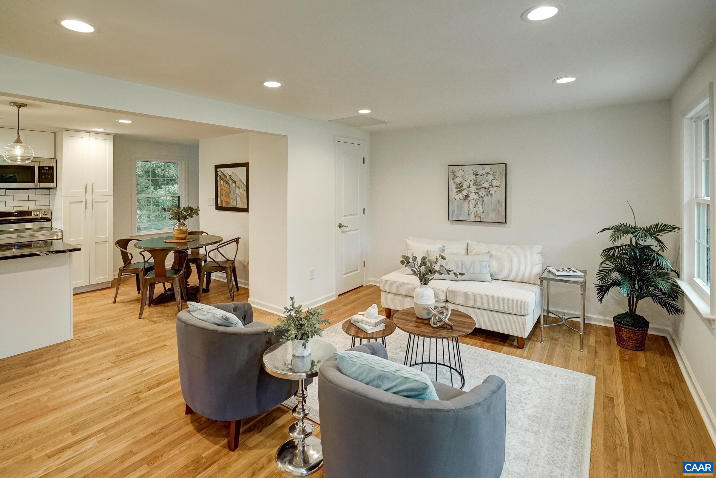 Refinished hardwood floors and neutral paint colors make the open floor plan bright and airy.