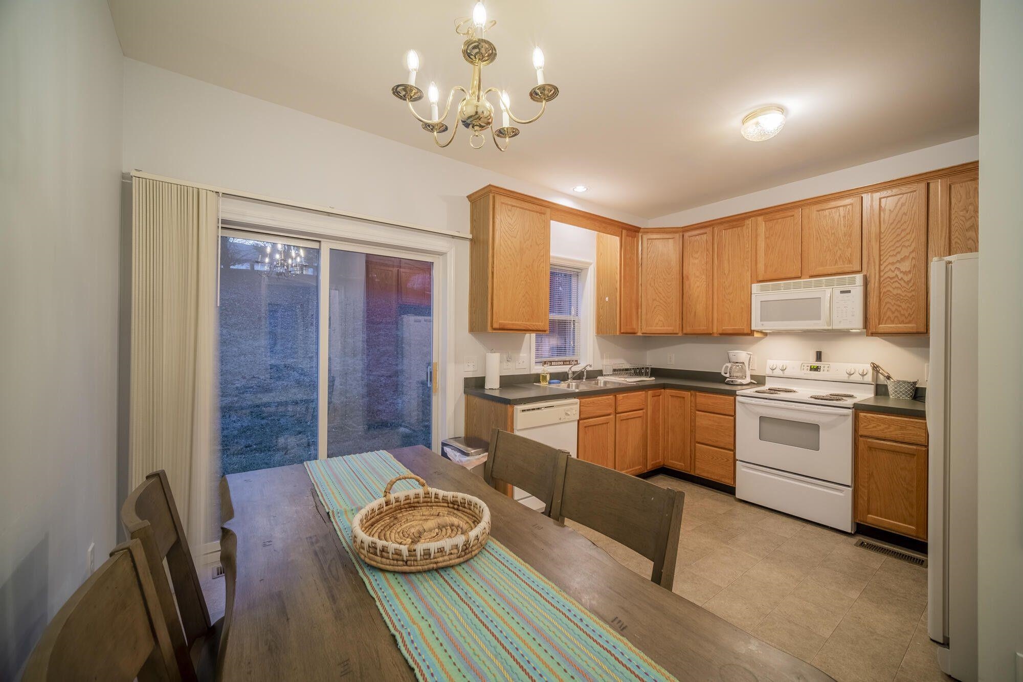 Eat-in Kitchen  Spacious eat-in kitchen with sliding glass door to a back patio.