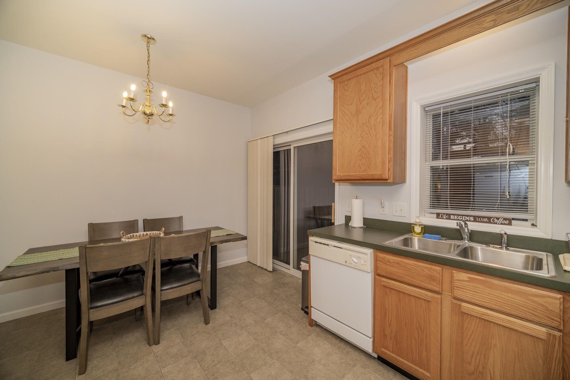 Eat-in Kitchen  Dining area in the kitchen leads to exterior patio for outdoor cooking.