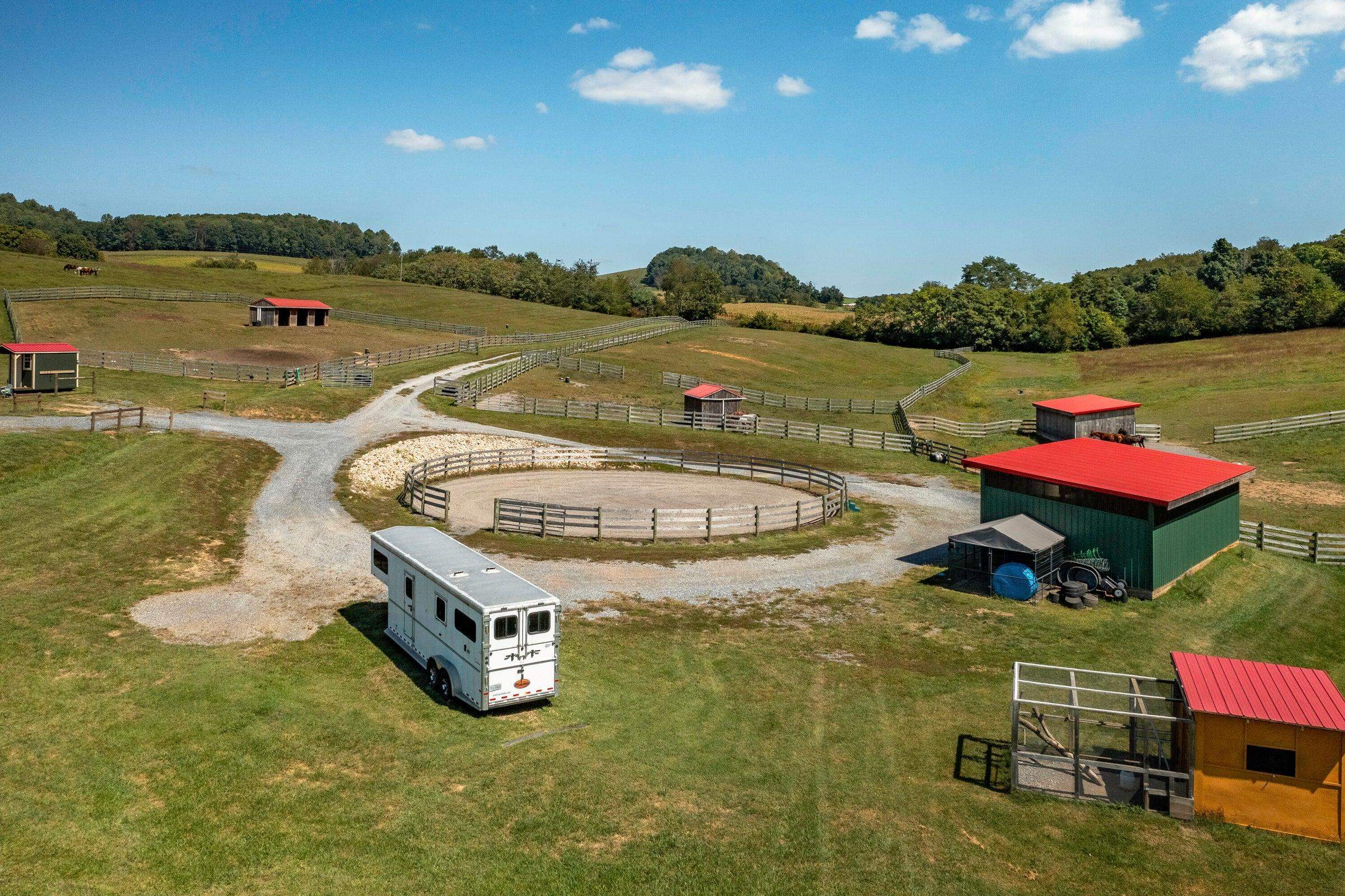 Round pen, bird coop, storage barn. Run-in shelters in the paddocks.