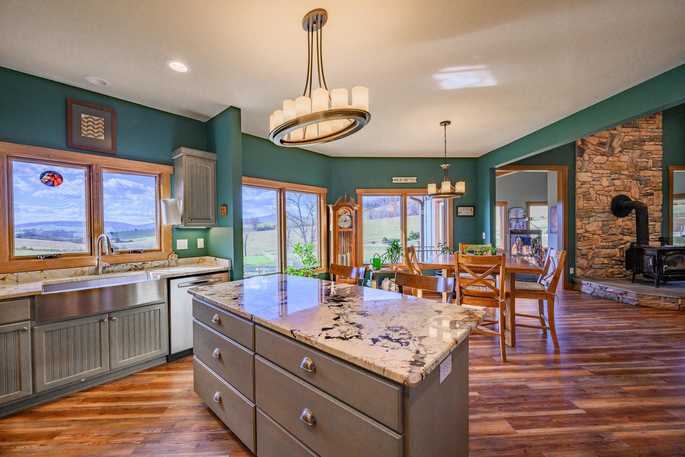 Kitchen and dining area looks out over the pastures, paddocks, arena and round pen.
