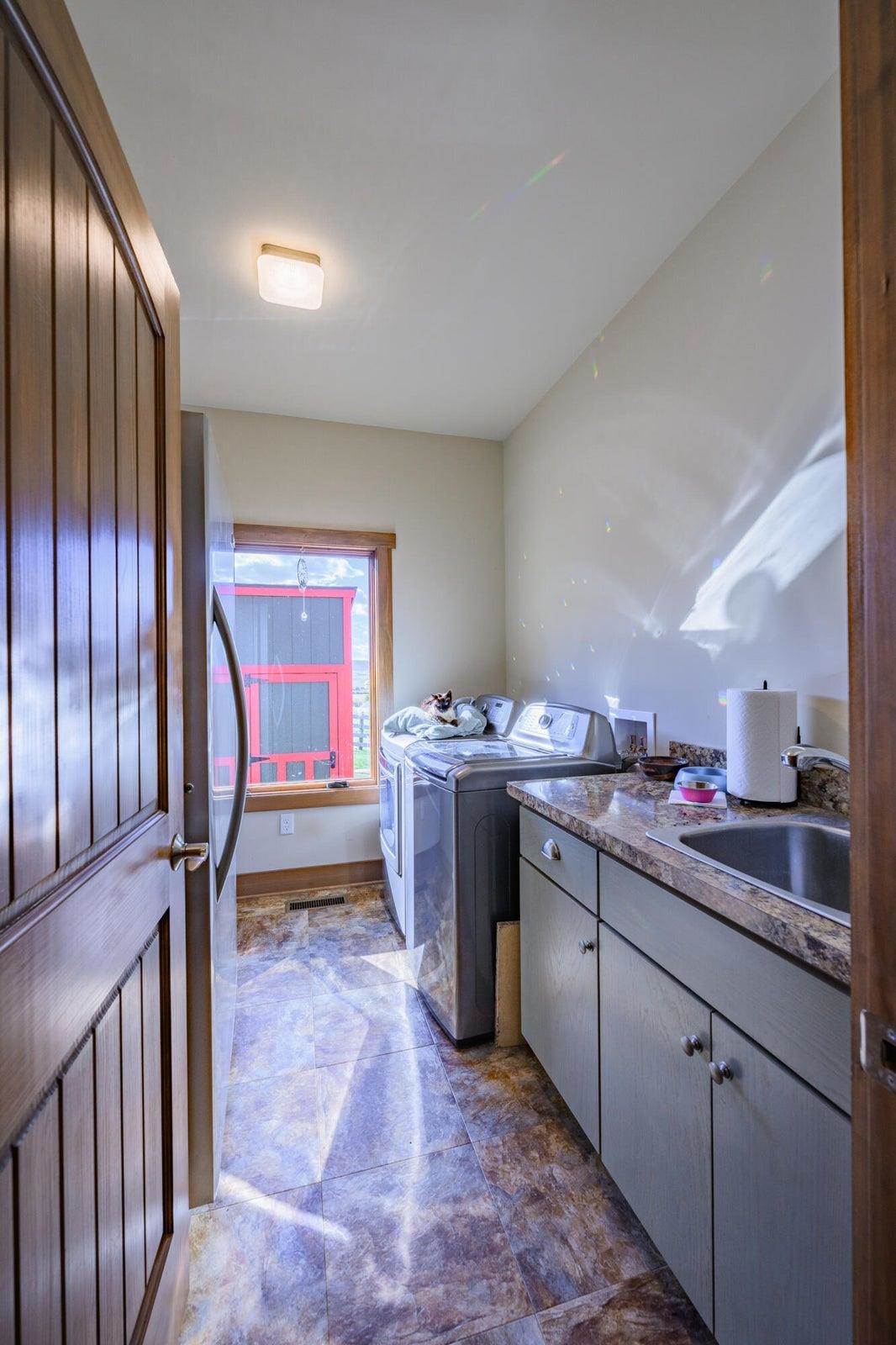 Vinyl tile floors in bathrooms and laundry.