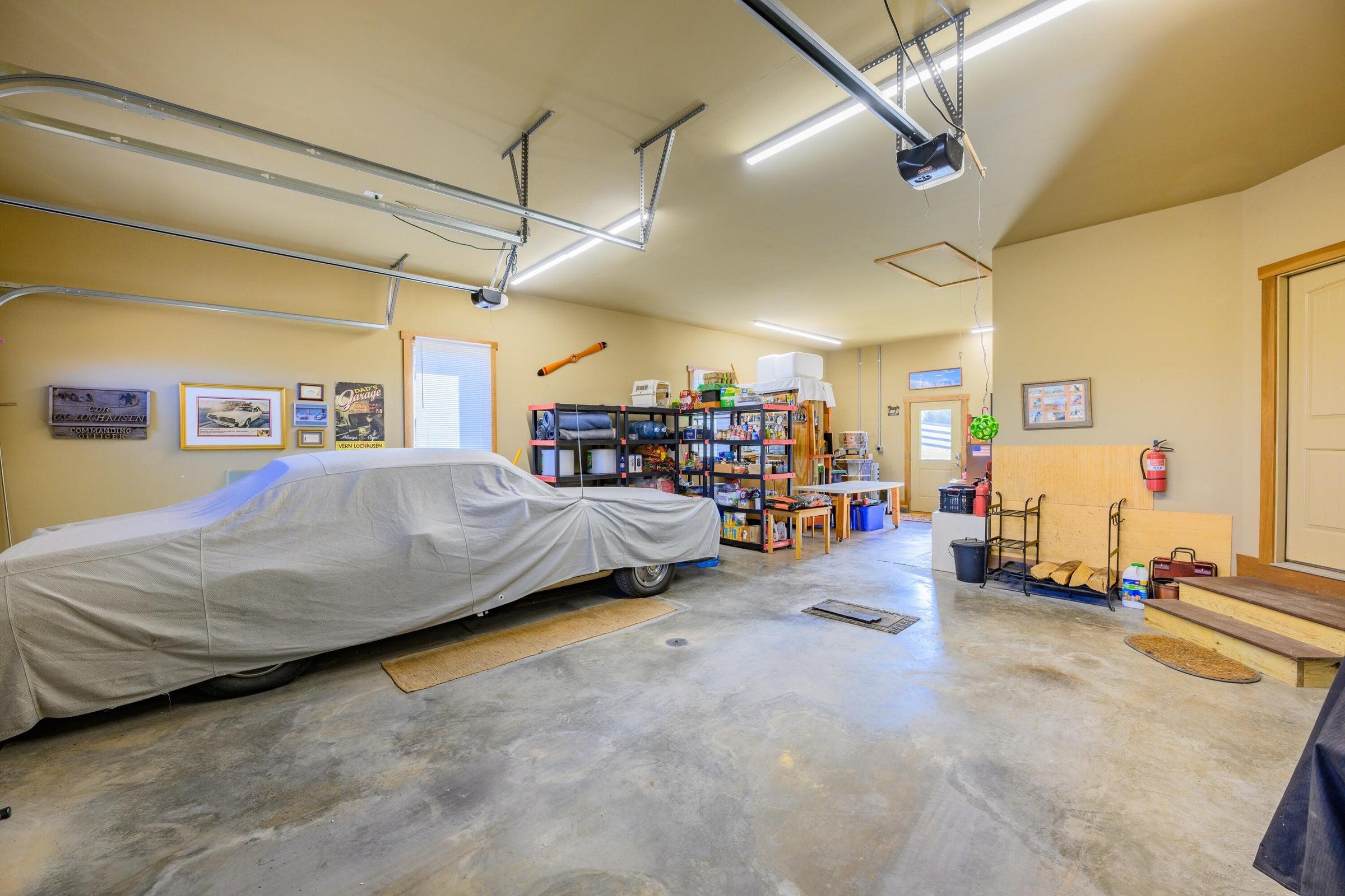 Spacious 2-car garage with lots of workshop and storage space.