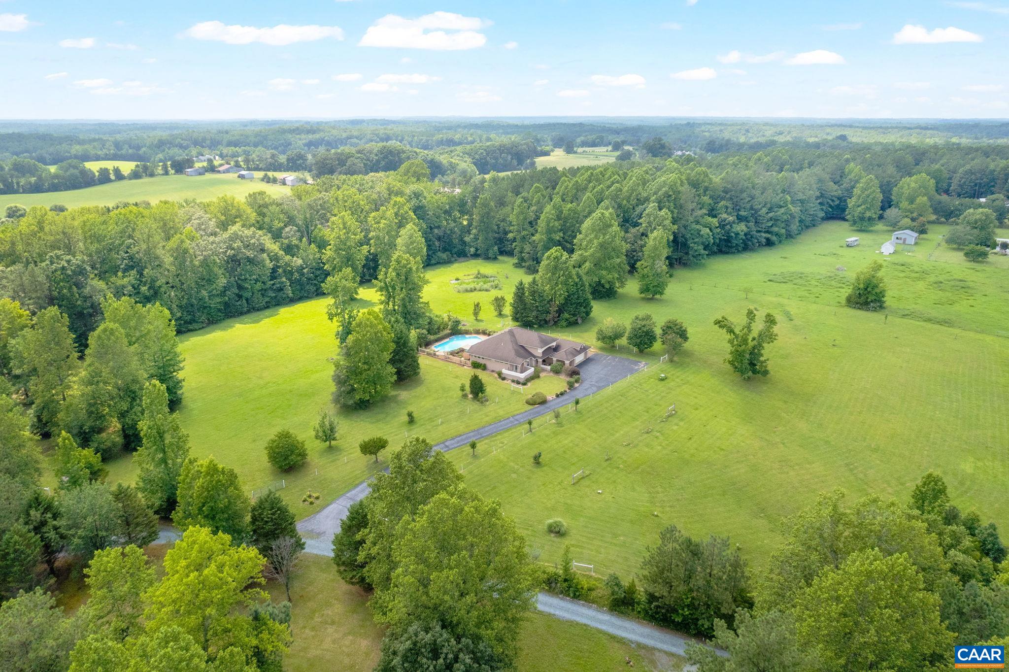 Mostly cleared with wooded buffer, the perimeter of the property is fully fenced and horse ready.