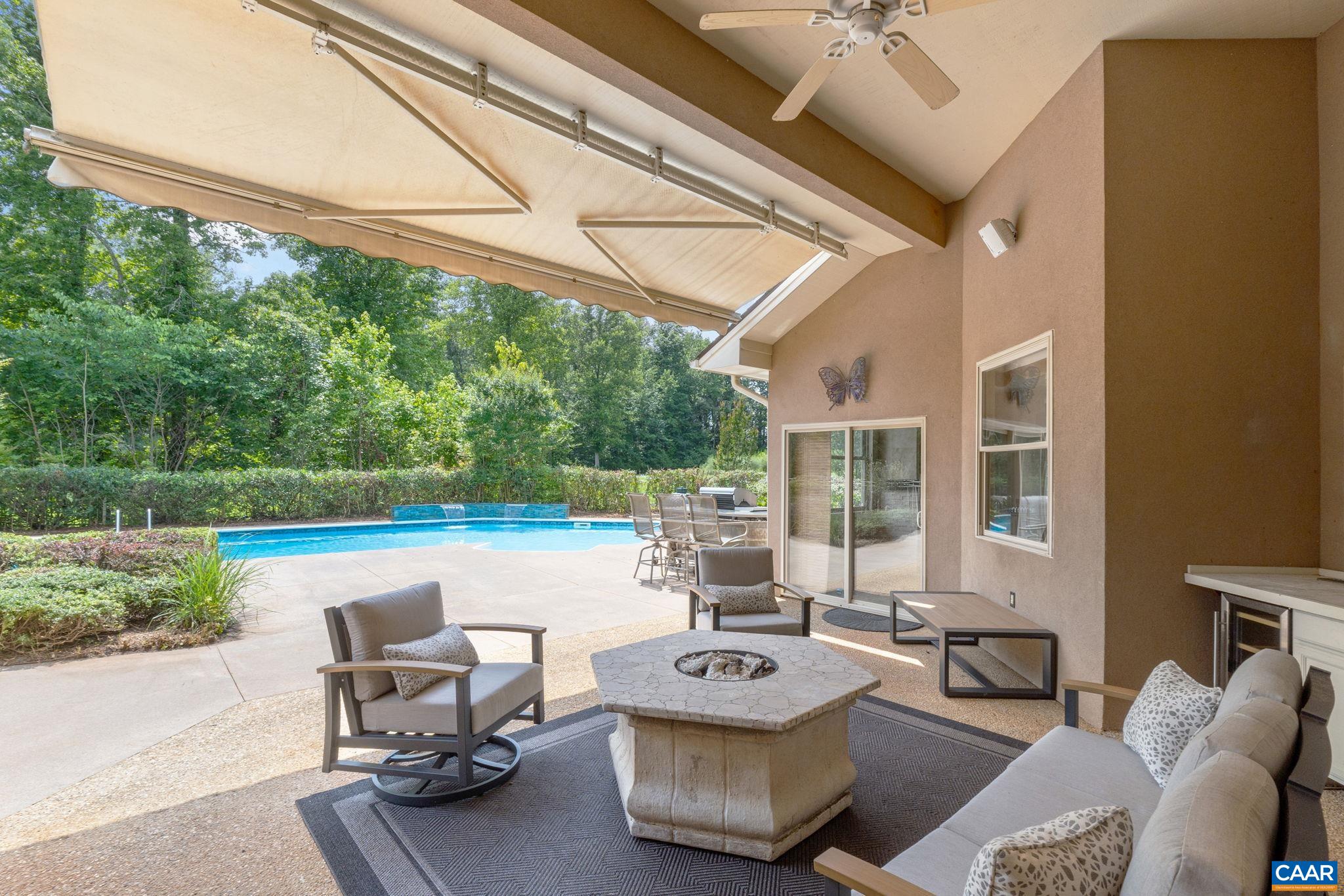Patio has built -in serving bar with beverage fringe, fire pit table, and direct access to 1/2 bath.