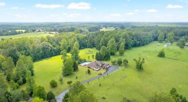 Mostly cleared with wooded buffer, the perimeter of the property is fully fenced and horse ready.
