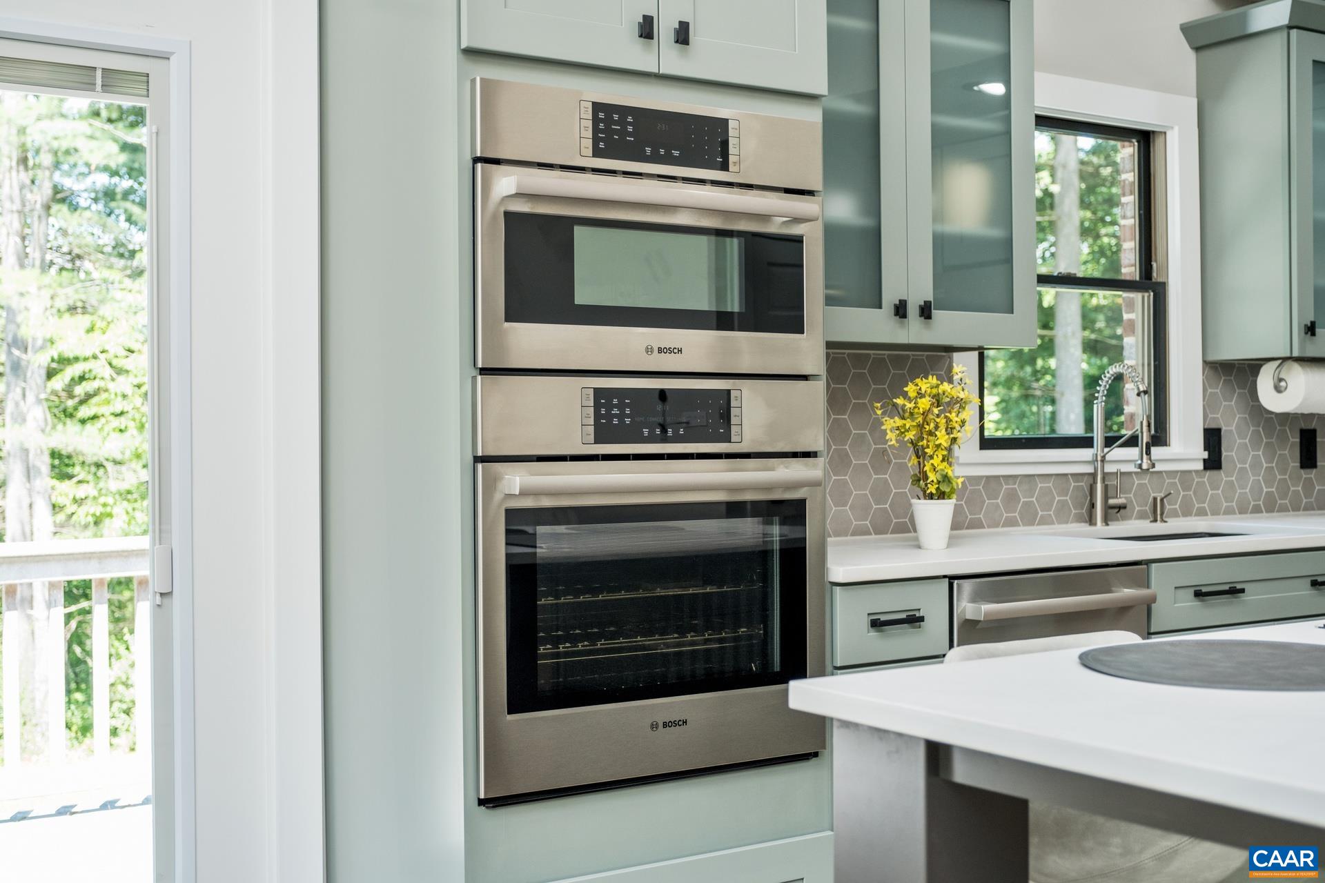The kitchen features a Bosch double oven and dishwasher.  The microwave doubles as a convection oven.