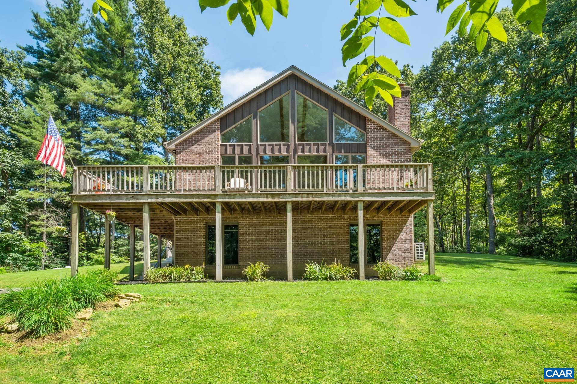 Deck wraps around two sides of the home, with plenty of room for entertaining.