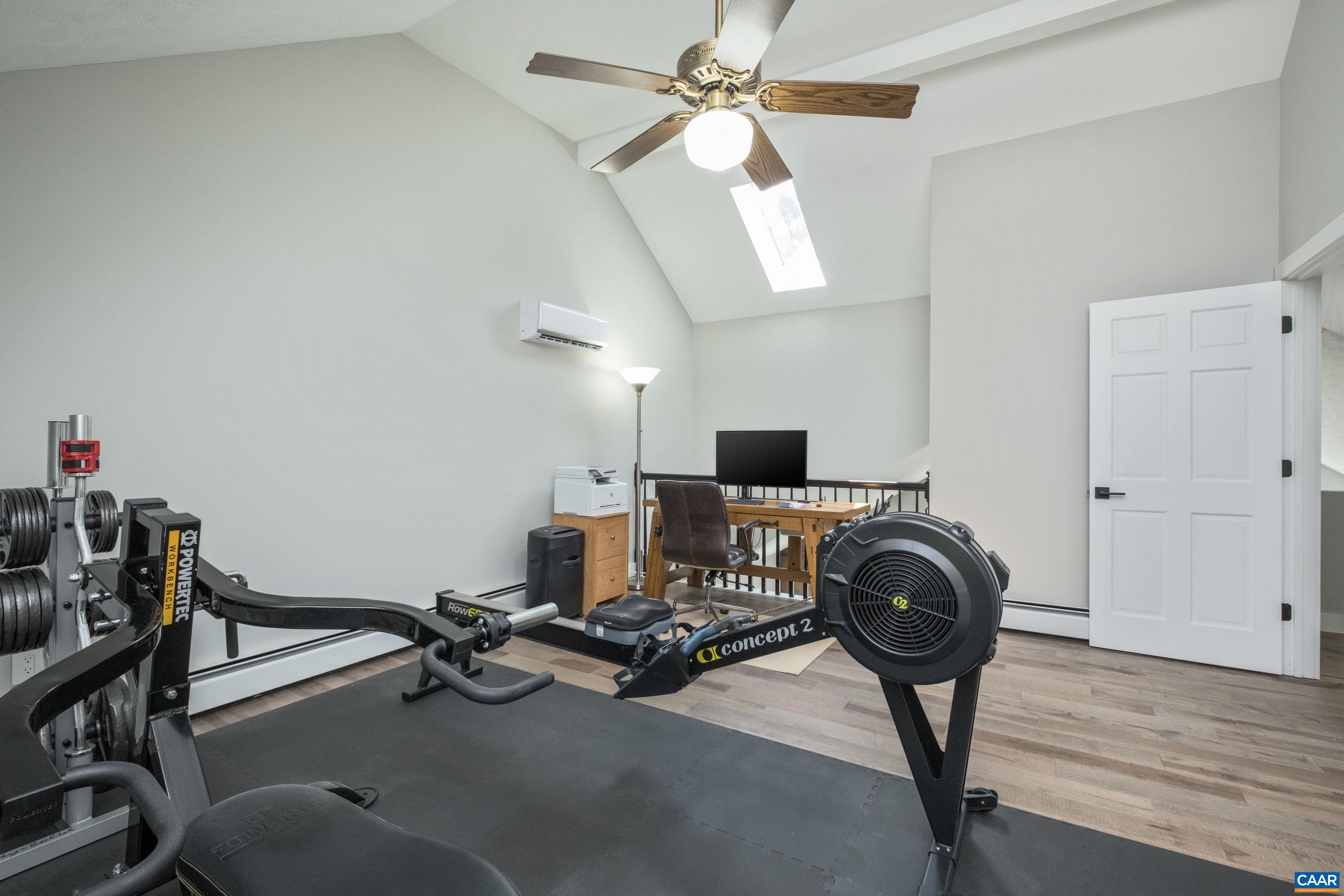 The loft area overlooks the great room and can potentially be turned into a 3rd bedroom.  The loft features solid maple flooring and a skylight.