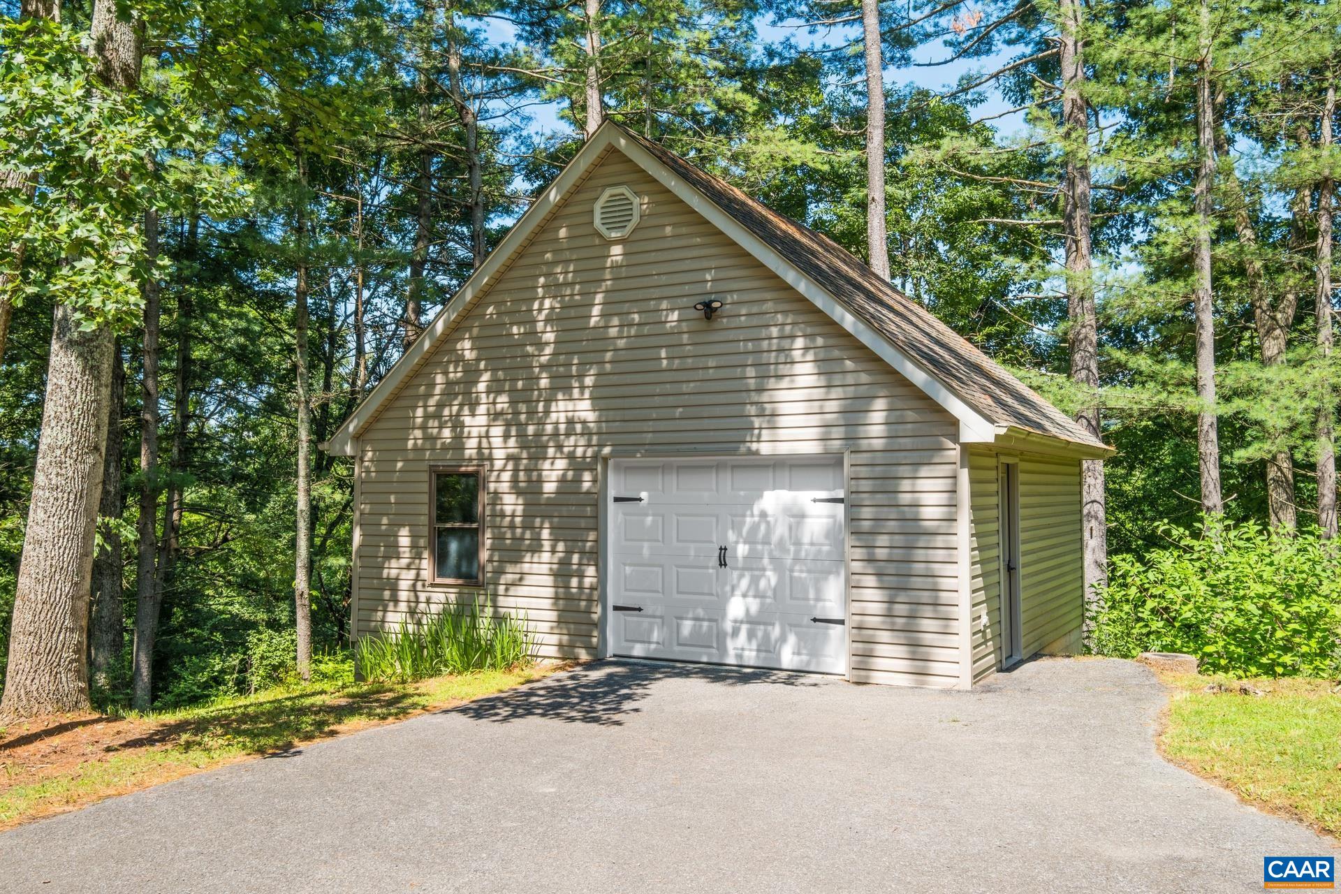 The detached garage features a propane heater and electricity.  It has a second bay that would make a great area for a workshop.