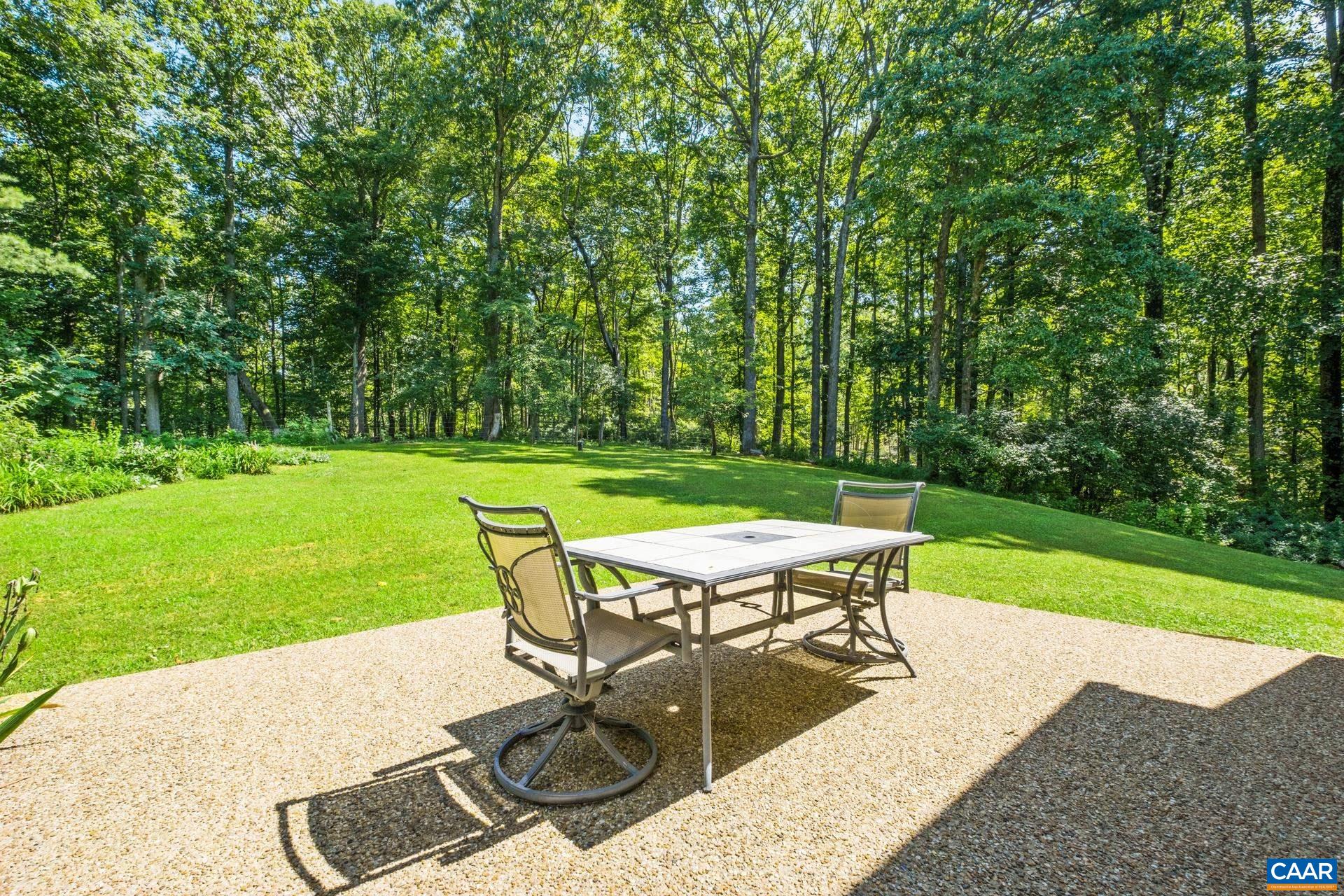 The large patio is located off of the main level primary suite.