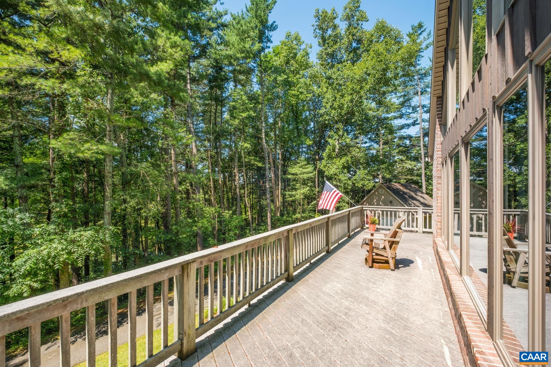 The deck on the front of the home extends the full length and is wide and spacious.