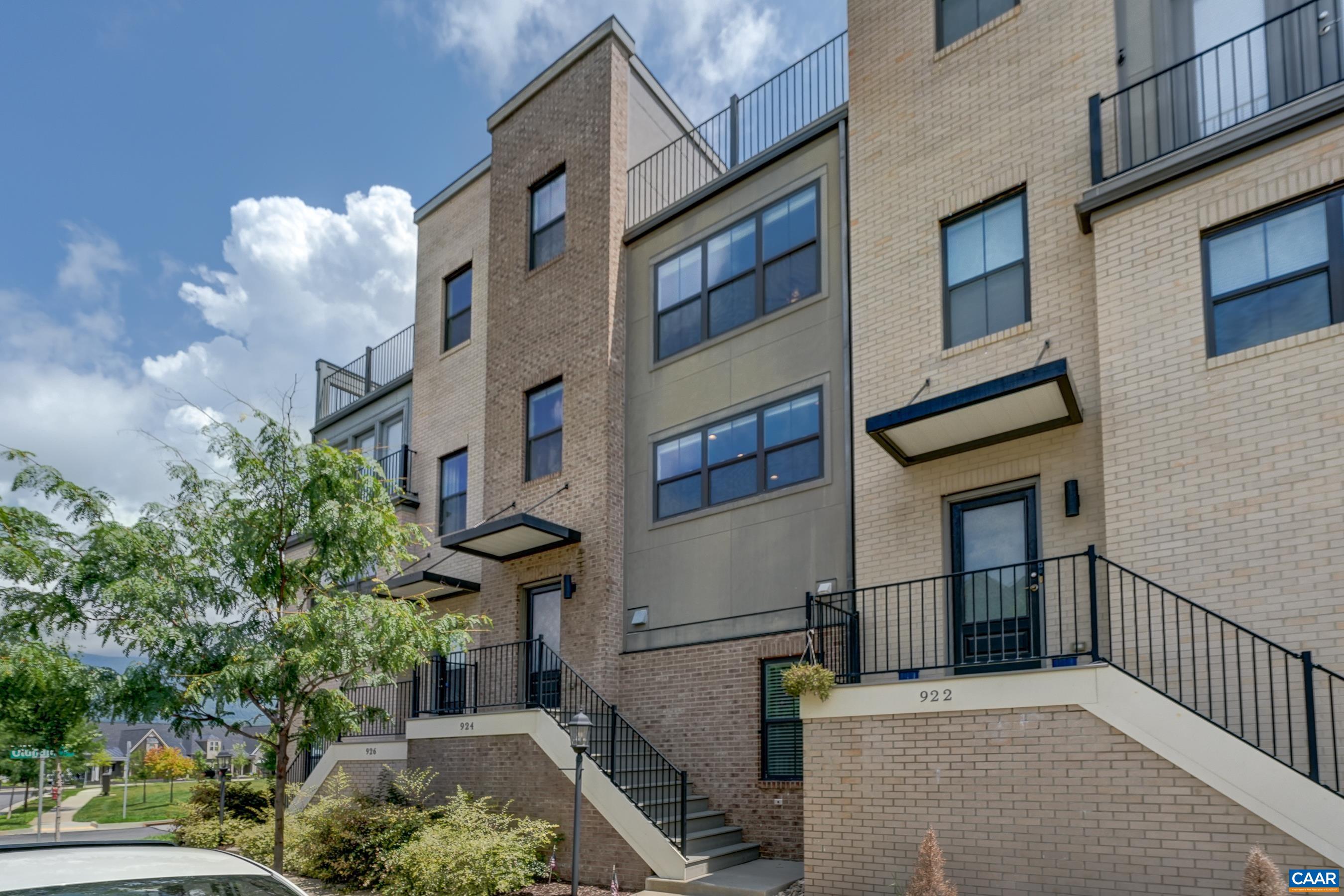 Quad level townhome with two primary suites and a rooftop deck in Old Trail!